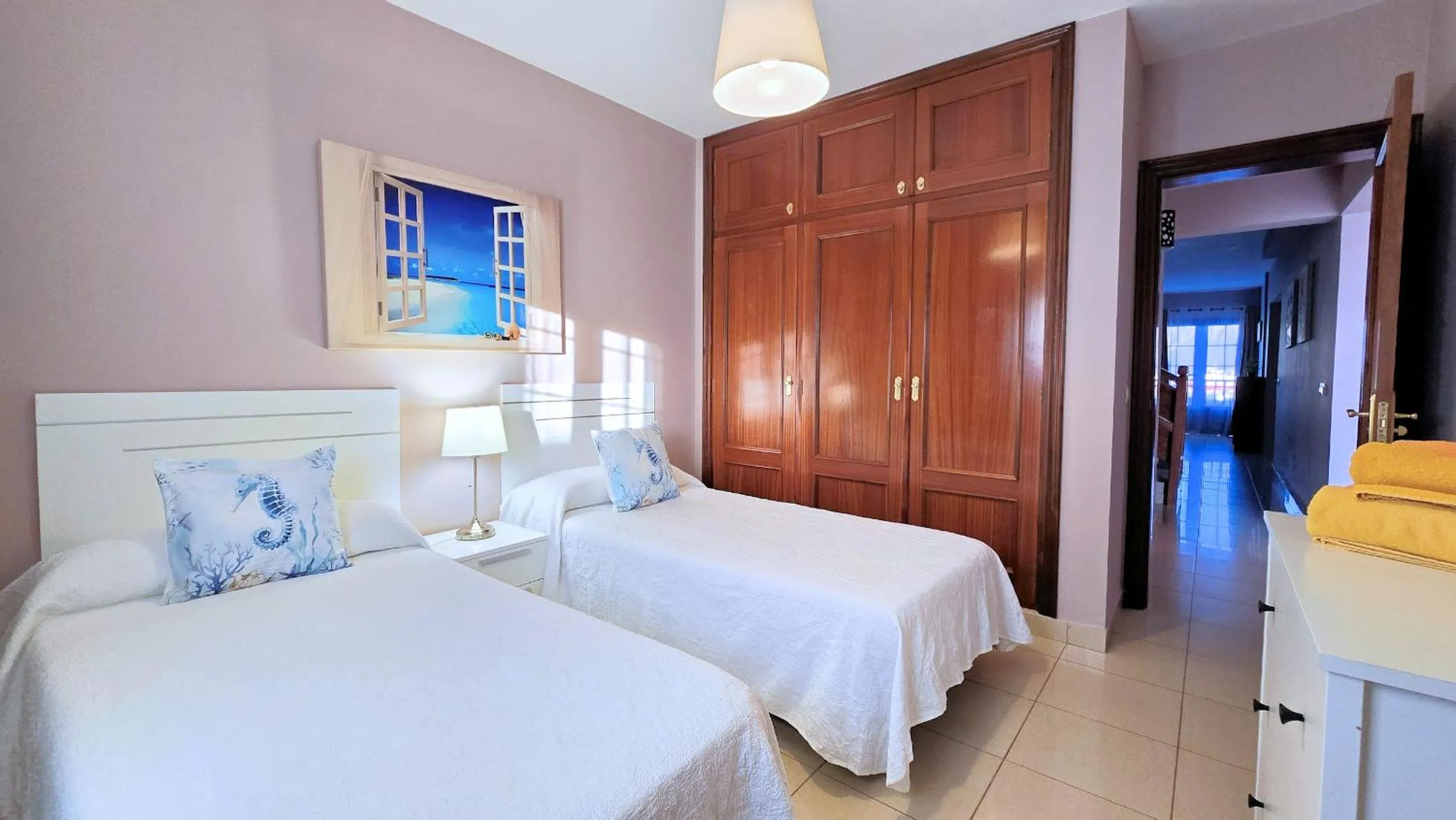 Bed in Evita Beach Suites Exclusivas