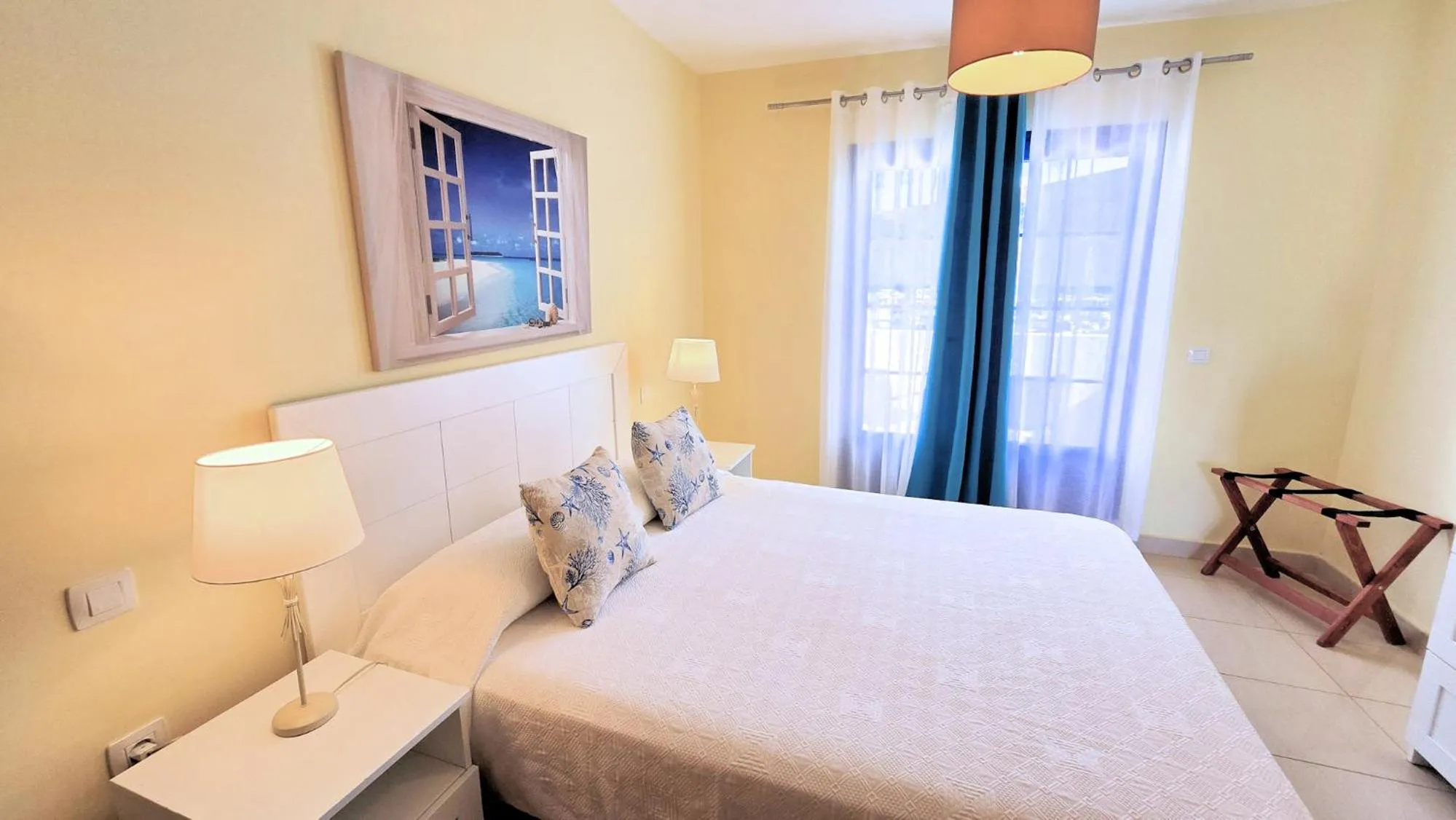 Bed in Evita Beach Suites Exclusivas