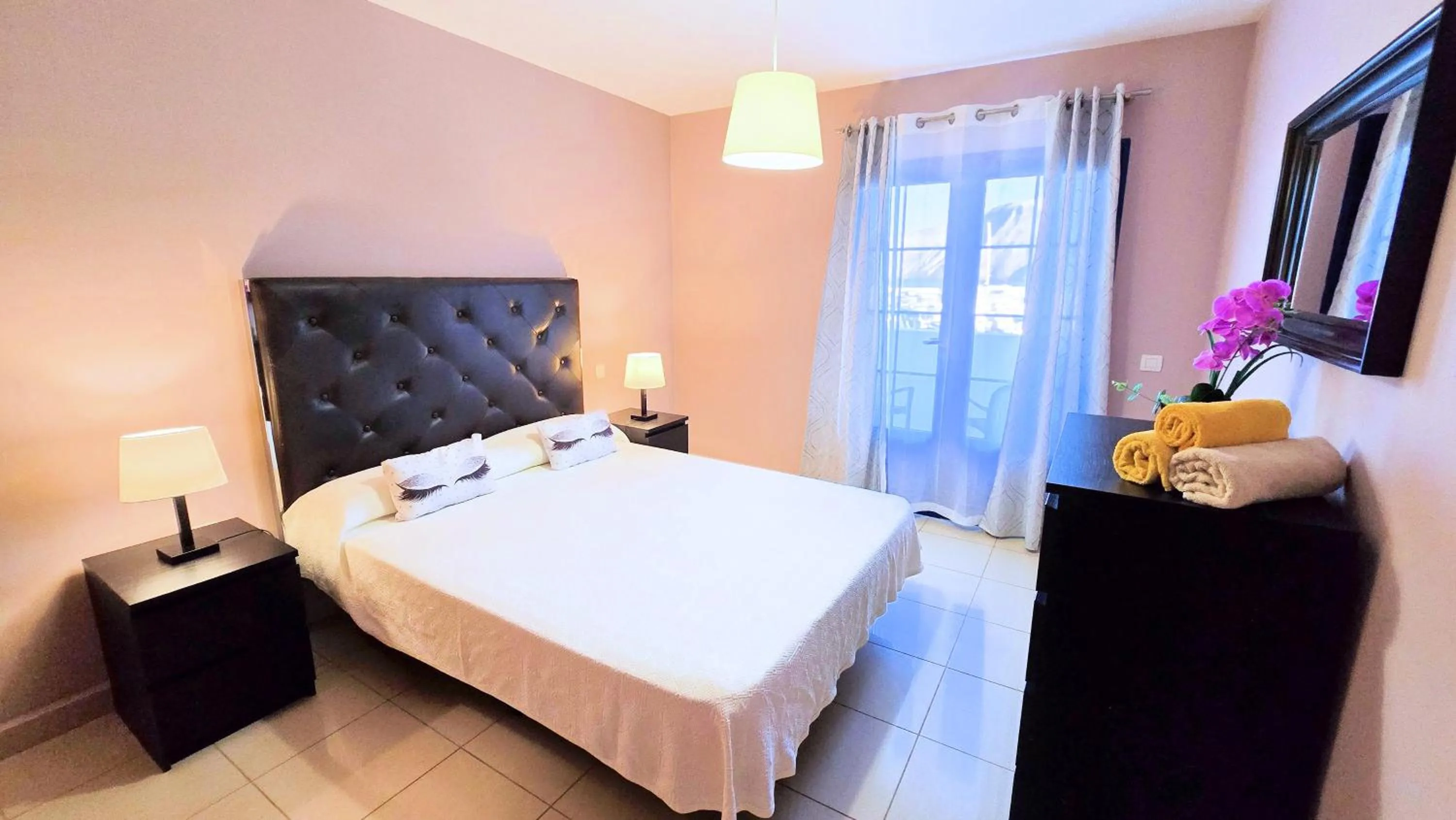 Bed in Evita Beach Suites Exclusivas