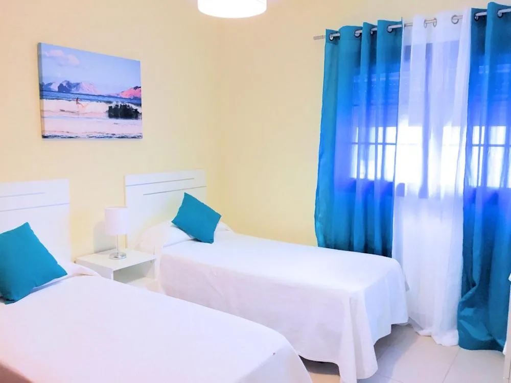 Bed in Evita Beach Suites Exclusivas