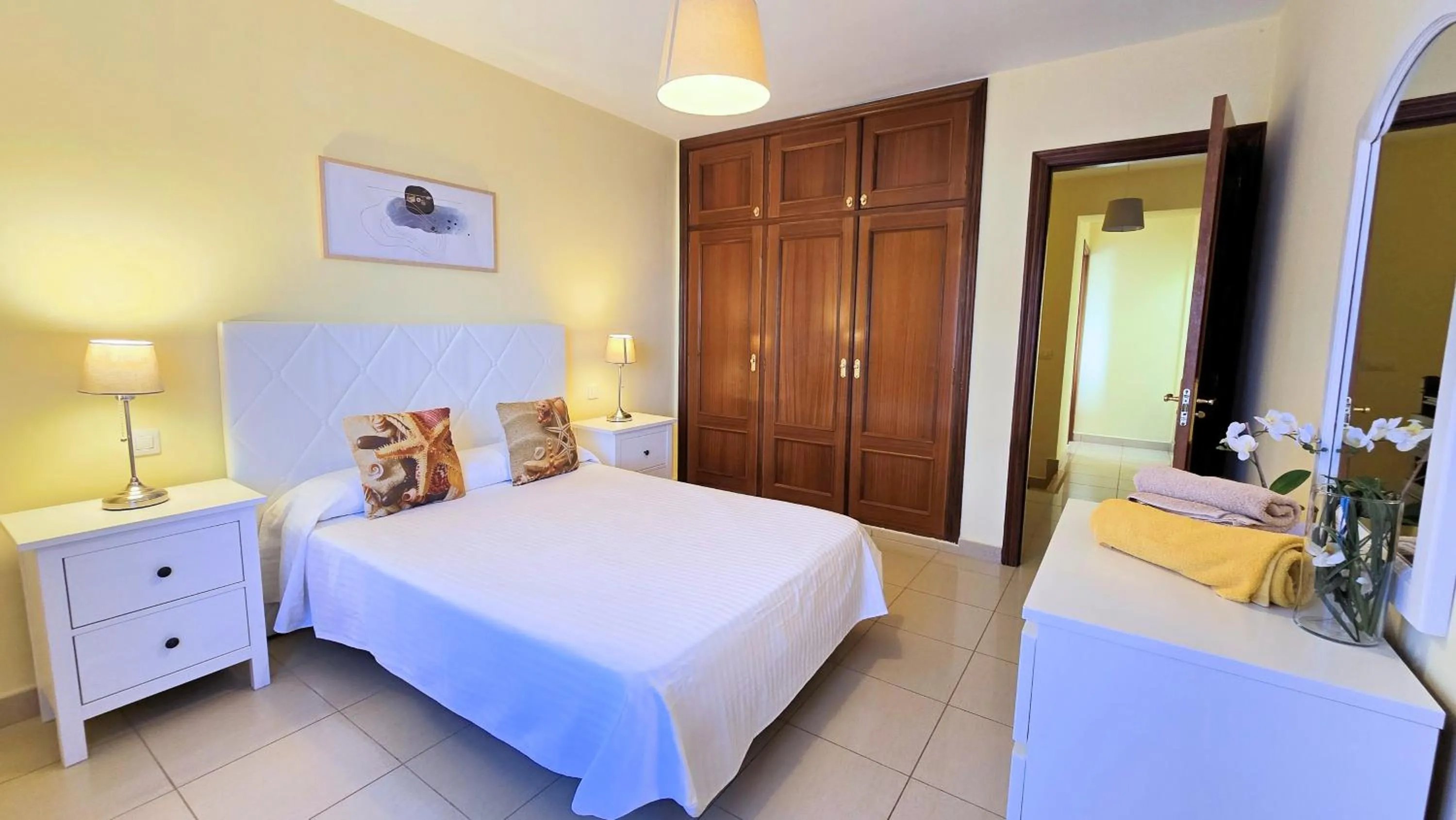 Bed in Evita Beach Suites Exclusivas