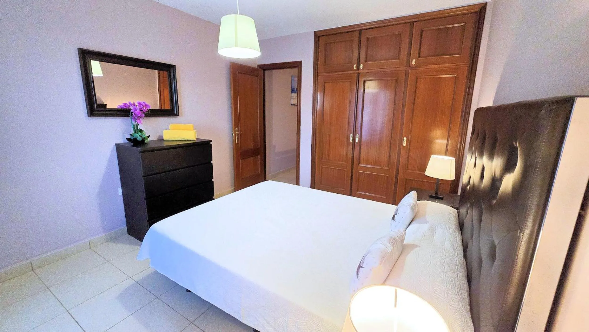 Bed in Evita Beach Suites Exclusivas