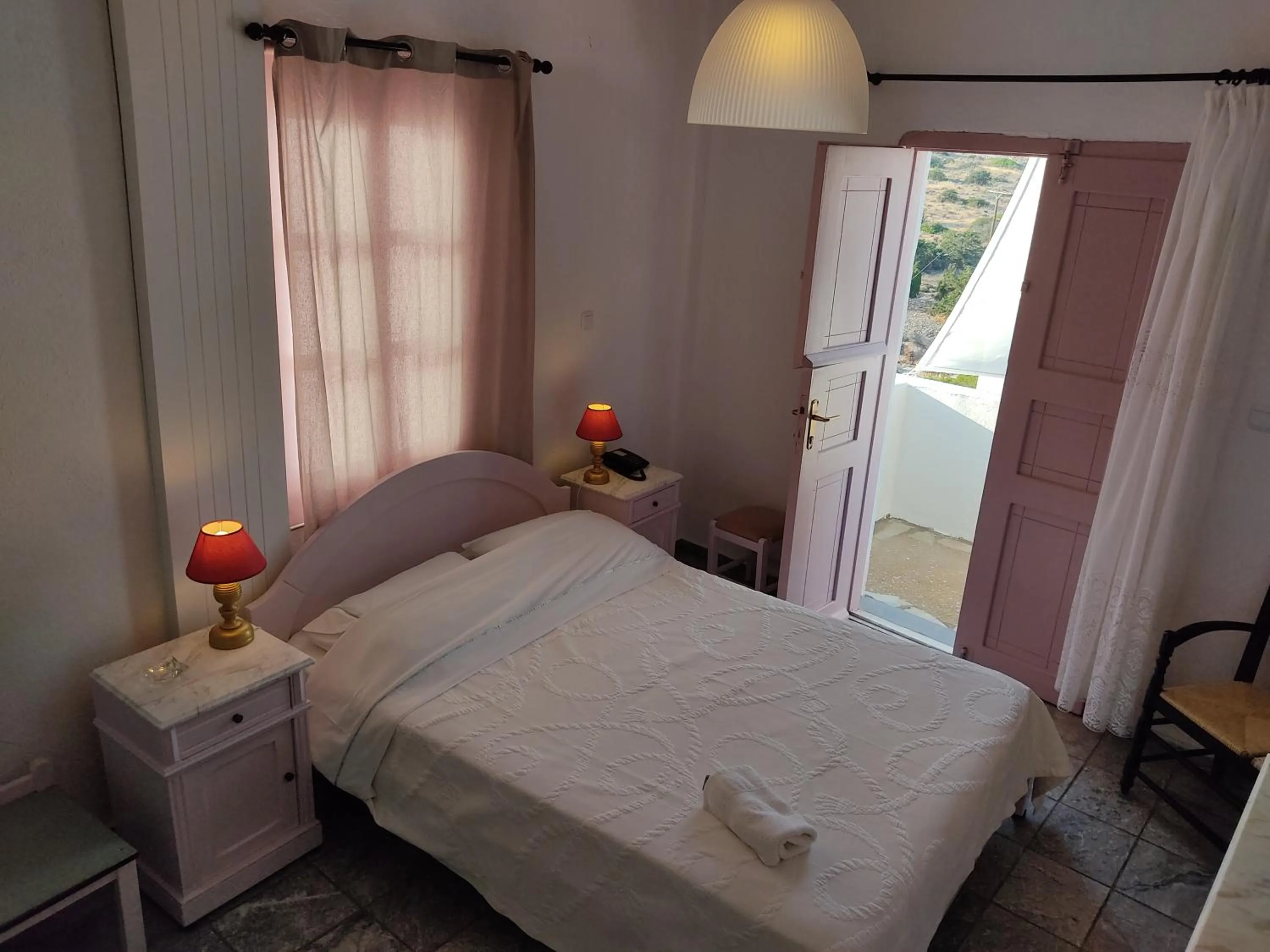 Bed in Porto Sikinos Hotel