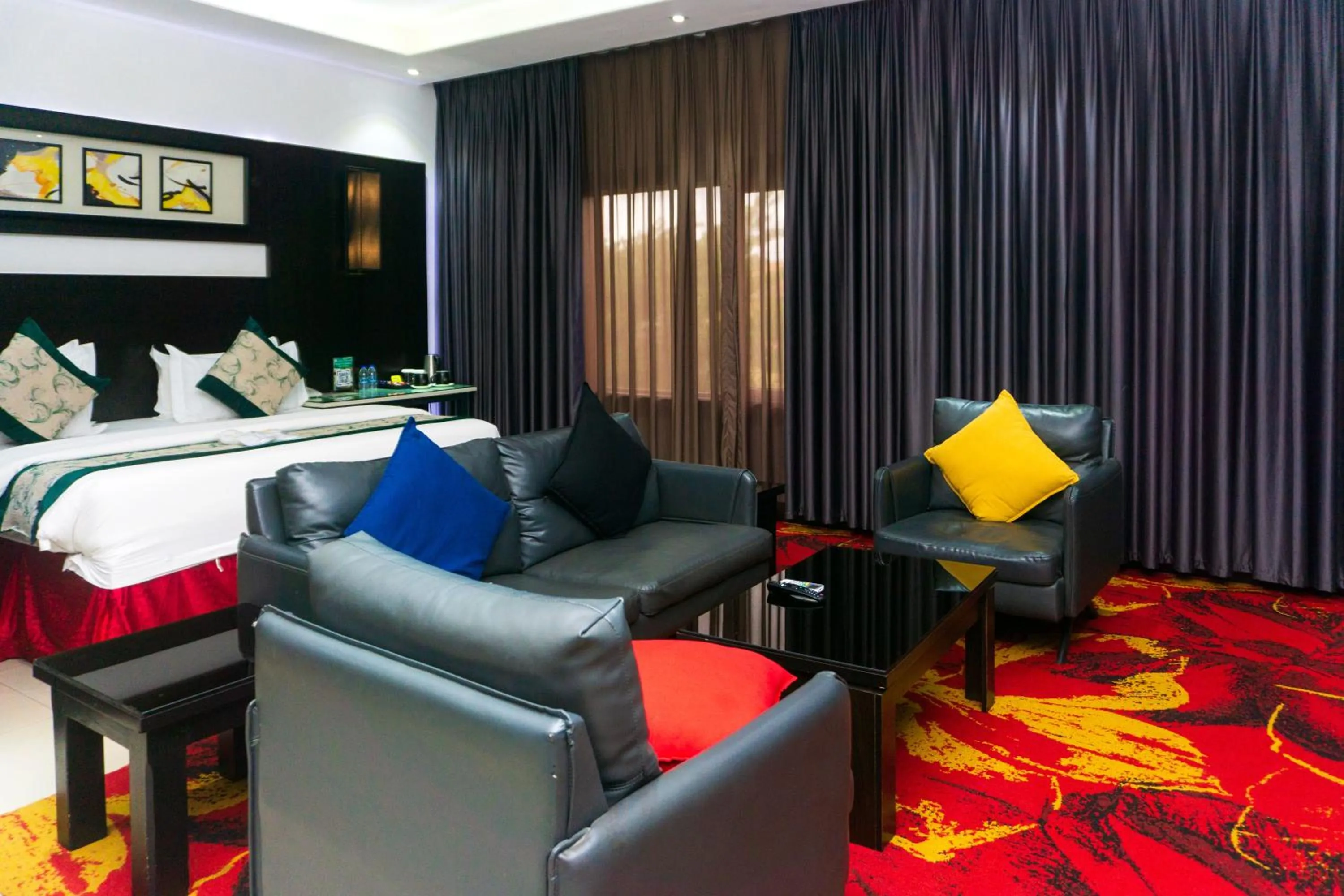 Seating area, Bed in GreenPoint Hotel