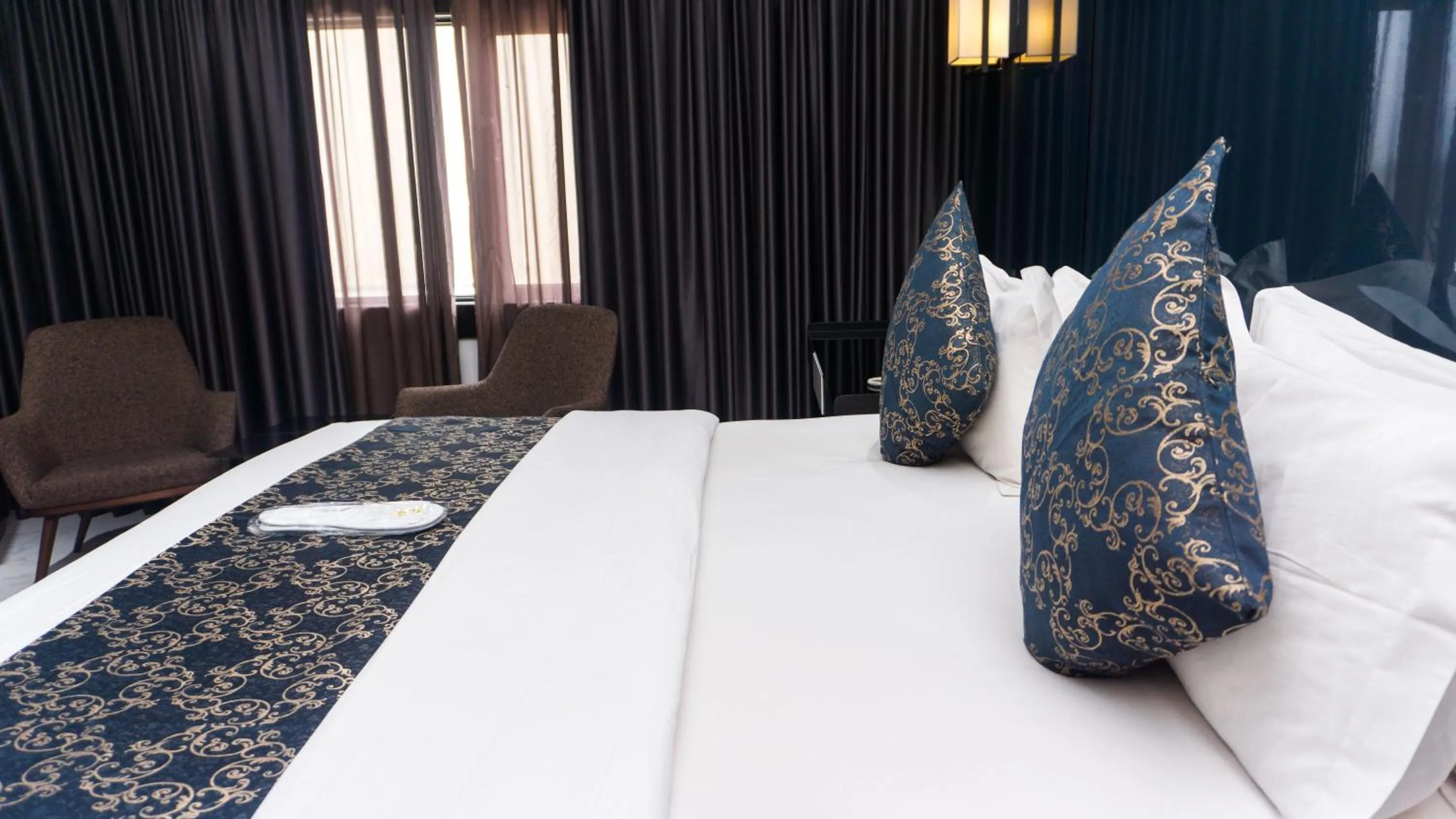 Bed in GreenPoint Hotel