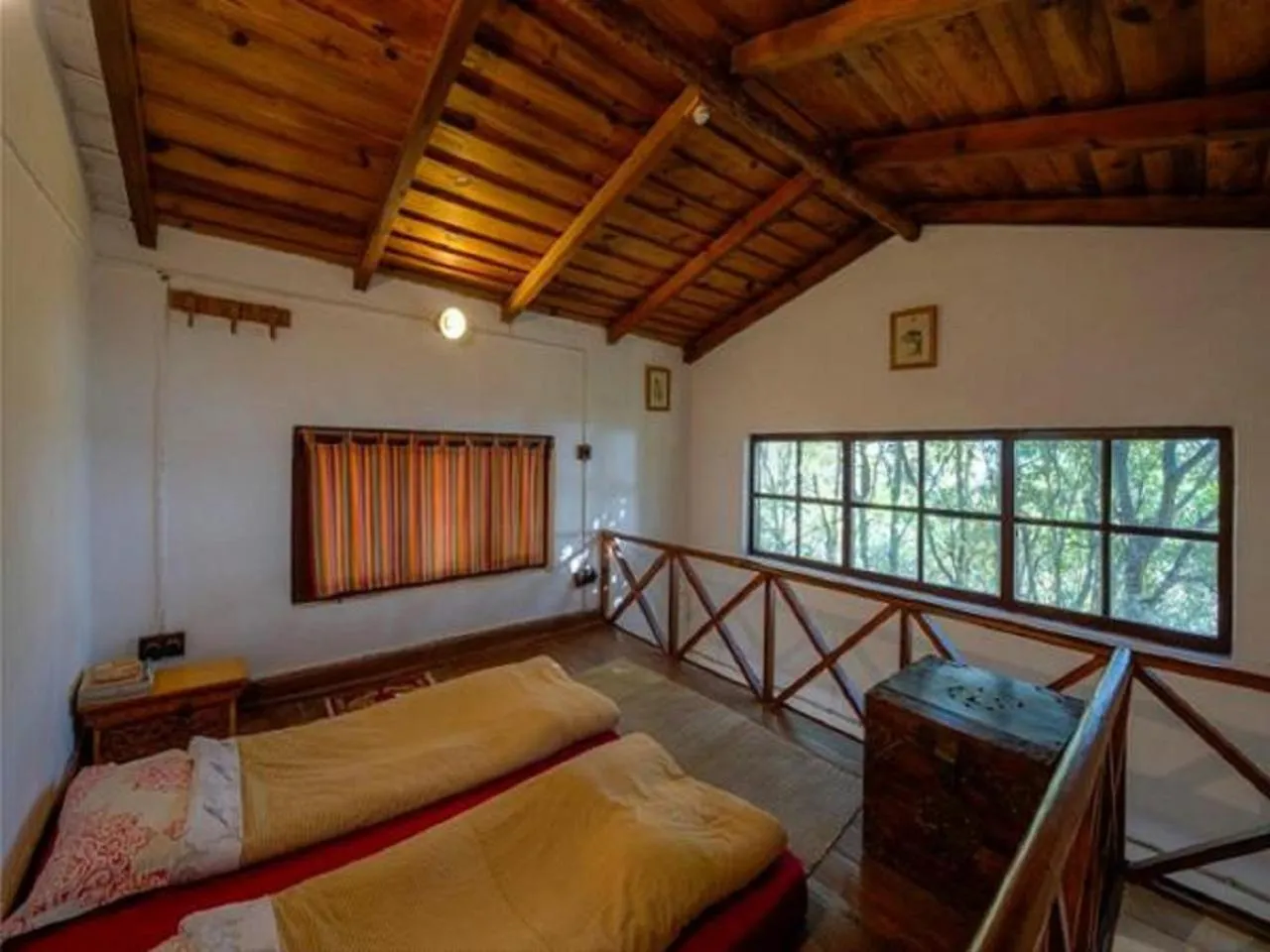 Bed in Jungle Lore Birding Lodge