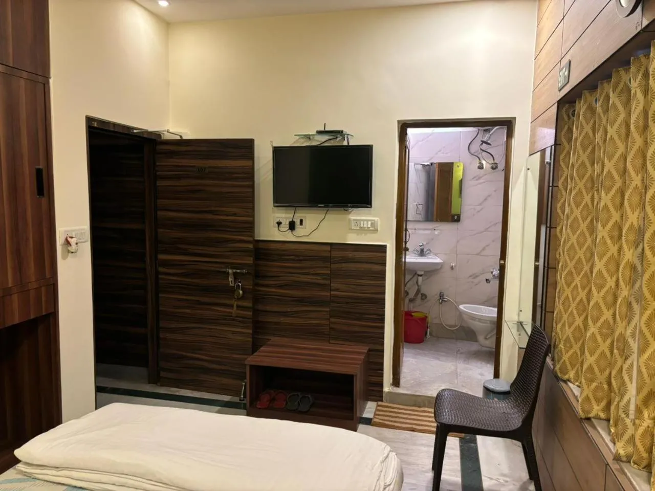 Bed in Om Sai Villa Guesthouse