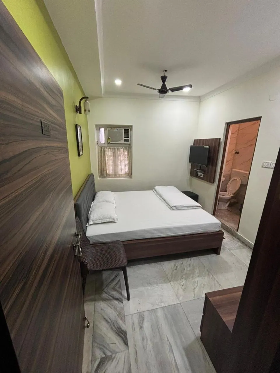 Bed in Om Sai Villa Guesthouse