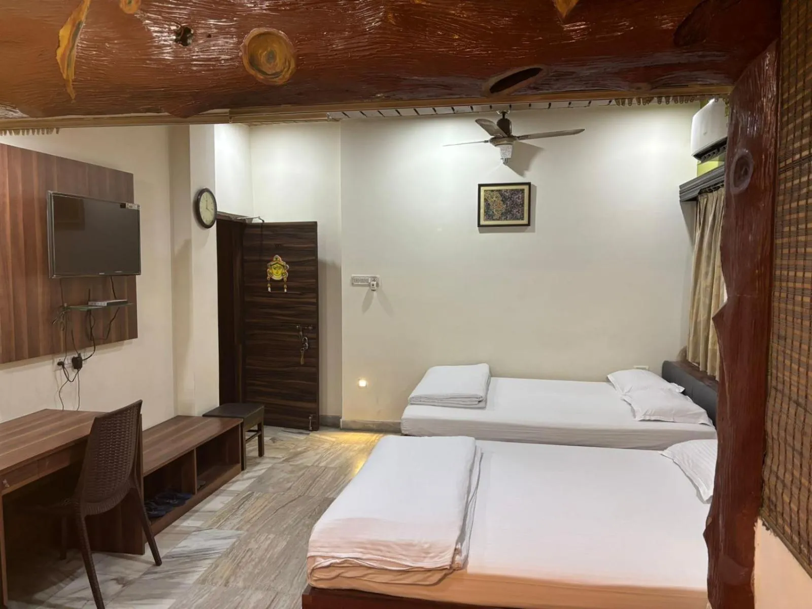 Bed in Om Sai Villa Guesthouse