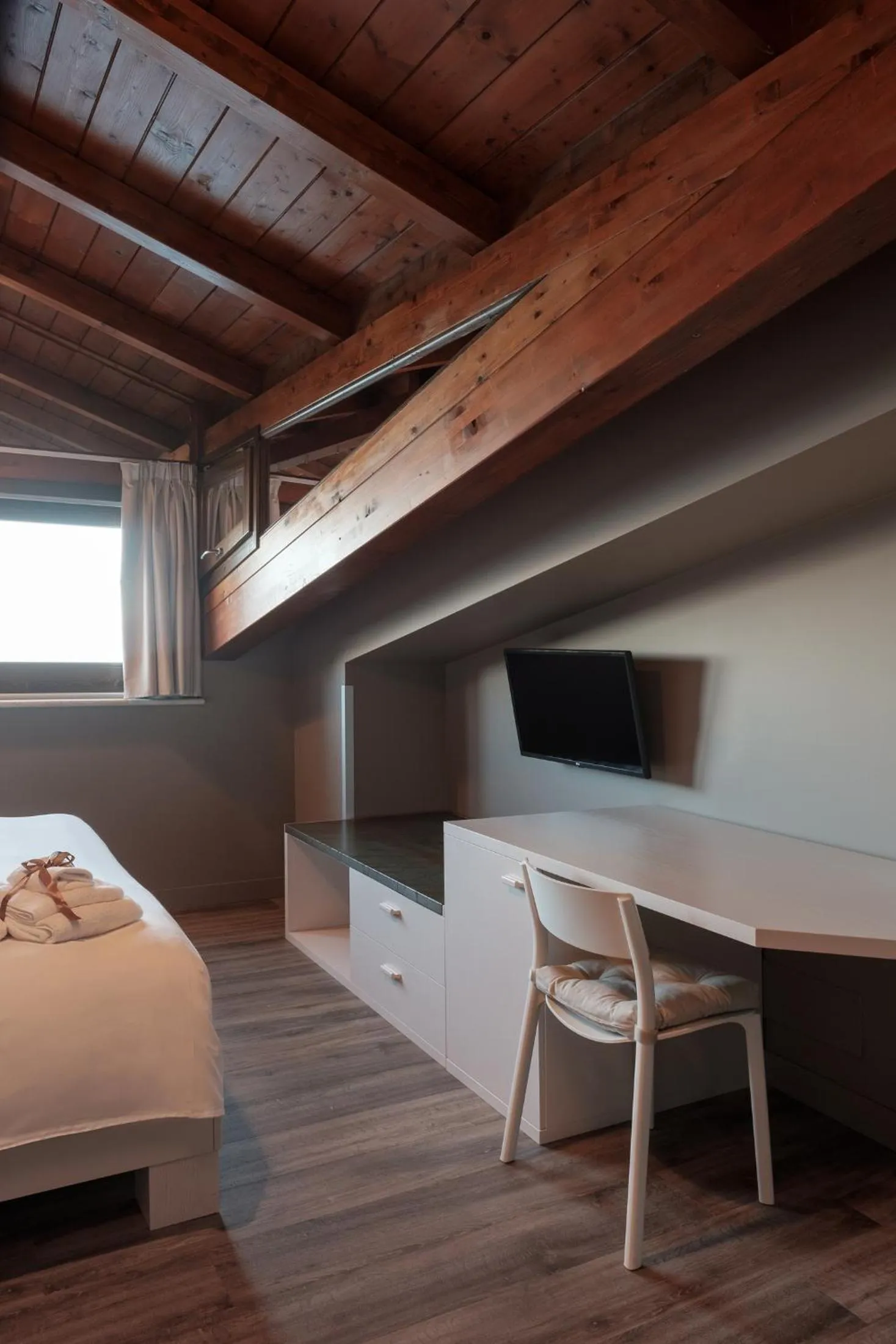 Bed in Il Casato Deluxe Rooms