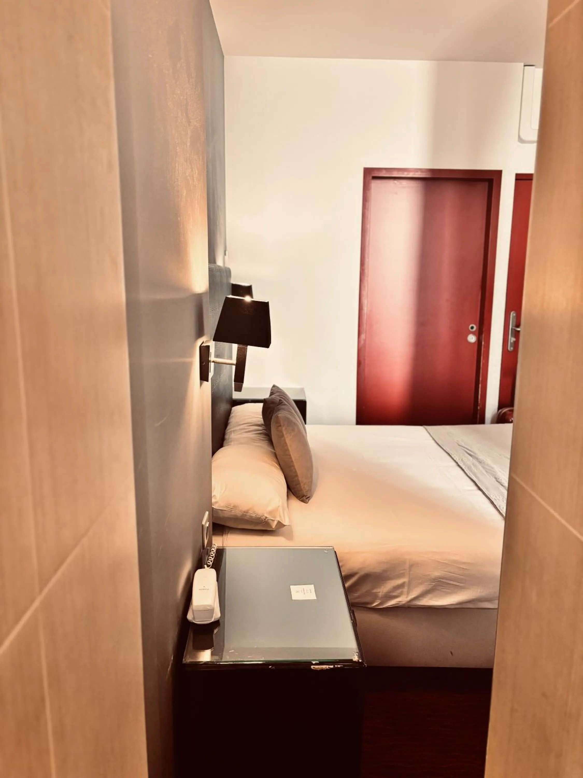 Bed in Logis Hôtel Saint Martin