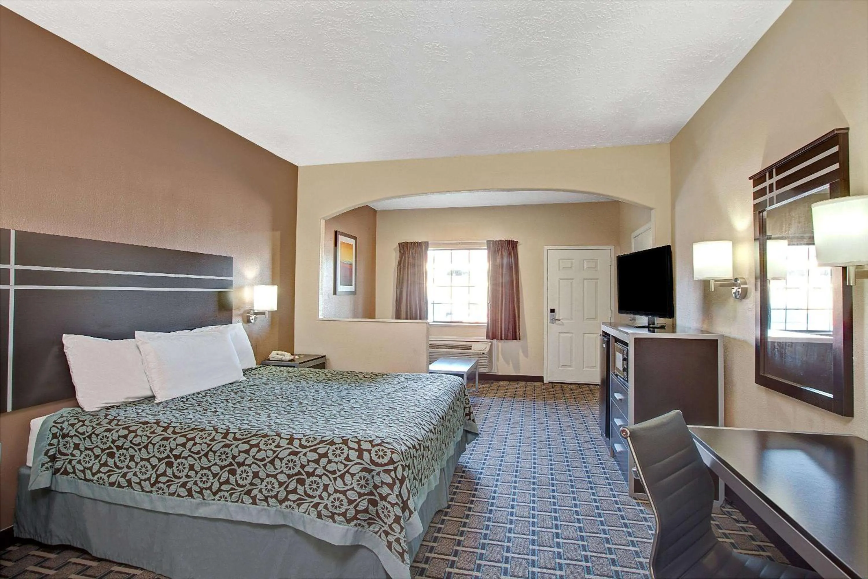 Photo of the whole room, Bed in Days Inn & Suites by Wyndham Houston North - Spring