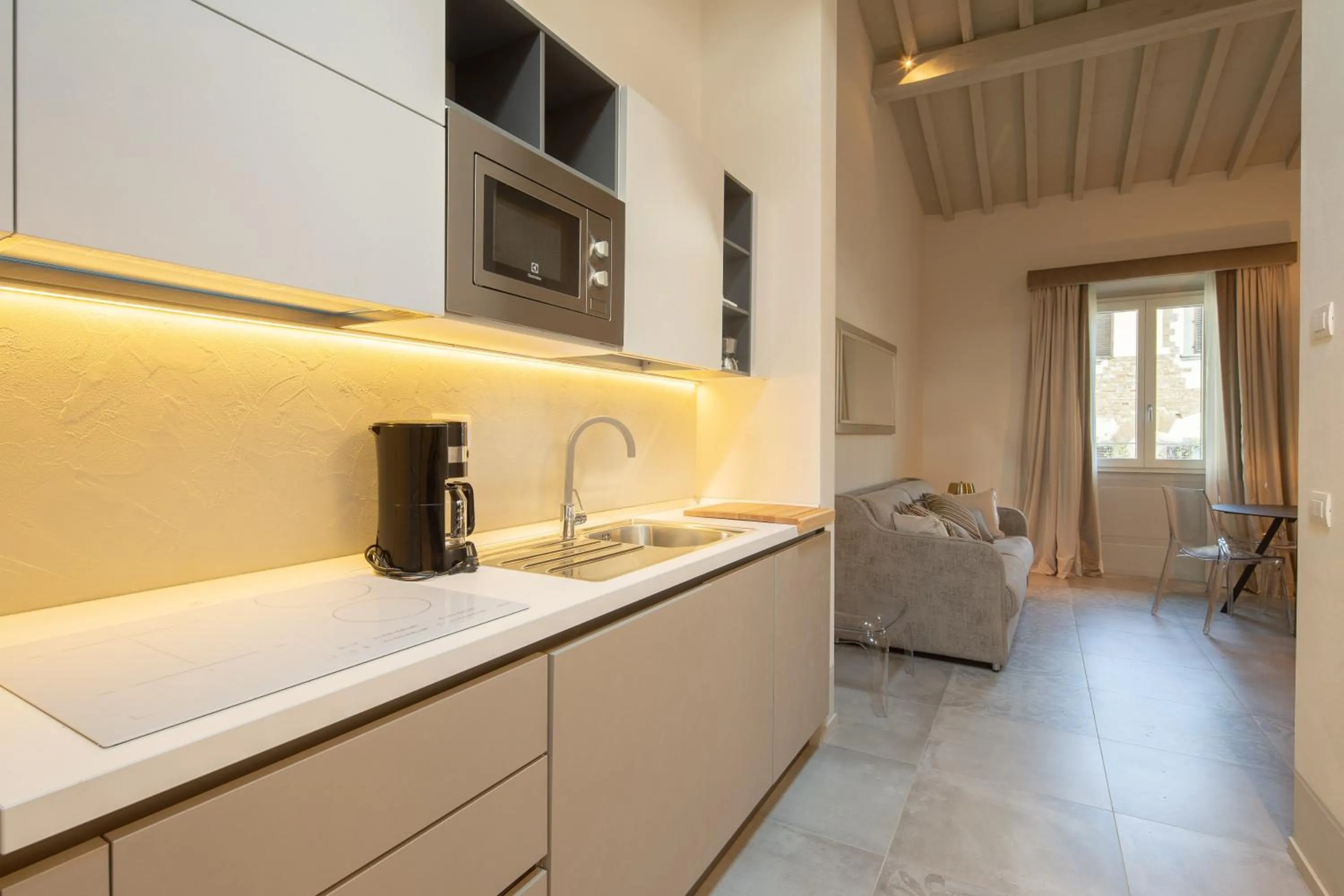 Kitchen or kitchenette in Carapelli Apartments