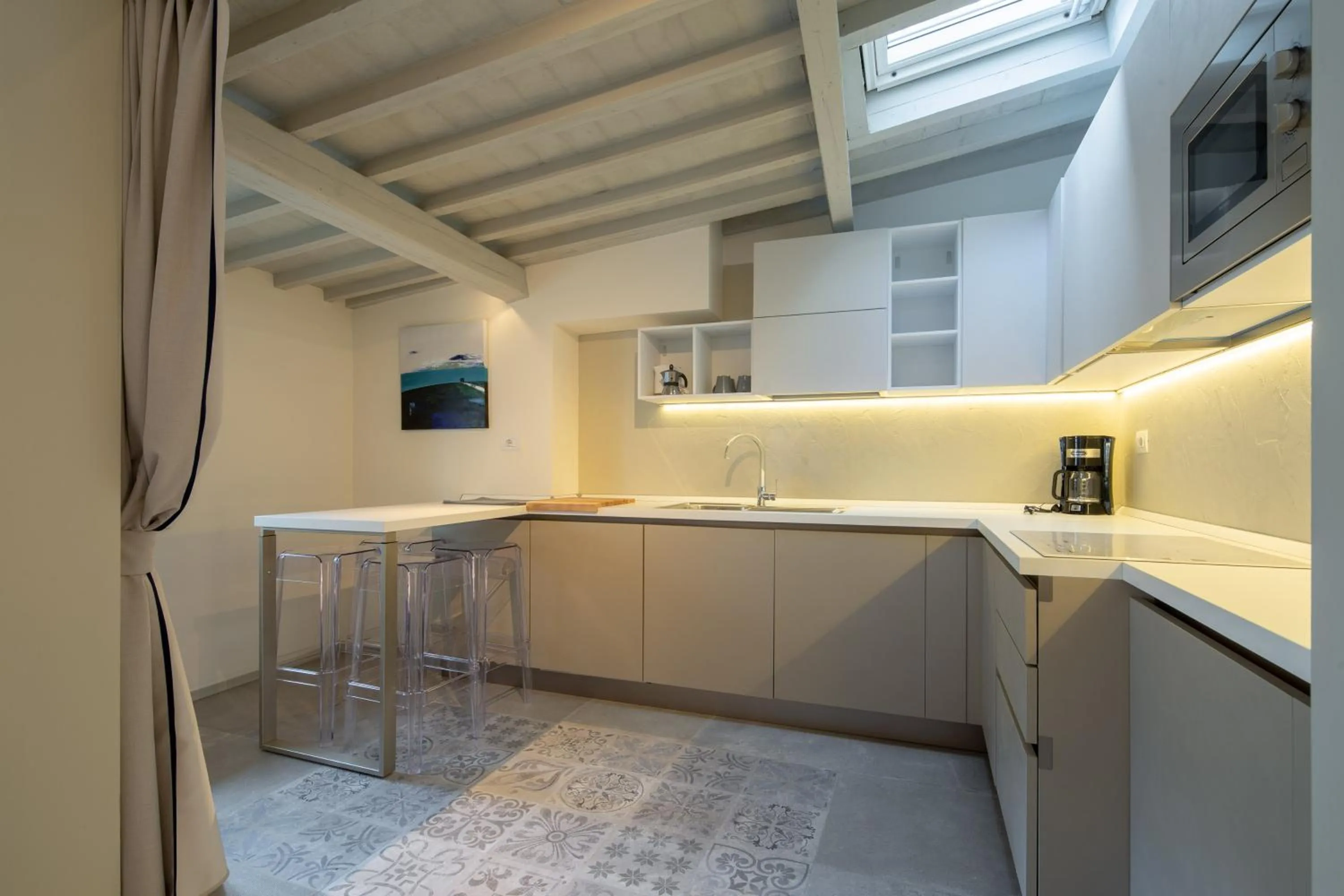 Kitchen or kitchenette in Carapelli Apartments