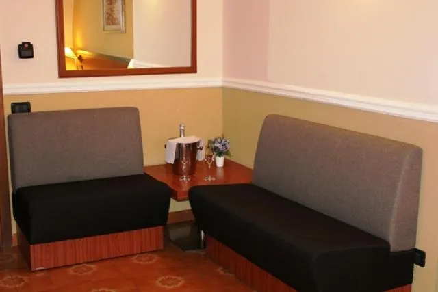 Seating area in DOMUS Grand Hotel