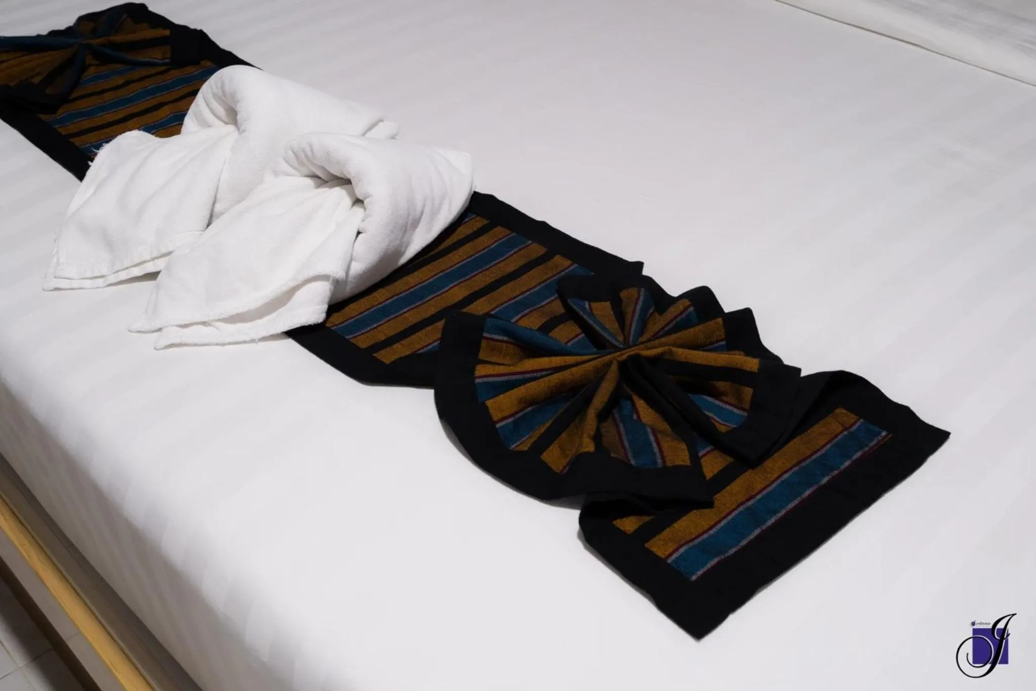 towels, Bed in Jintana Resort
