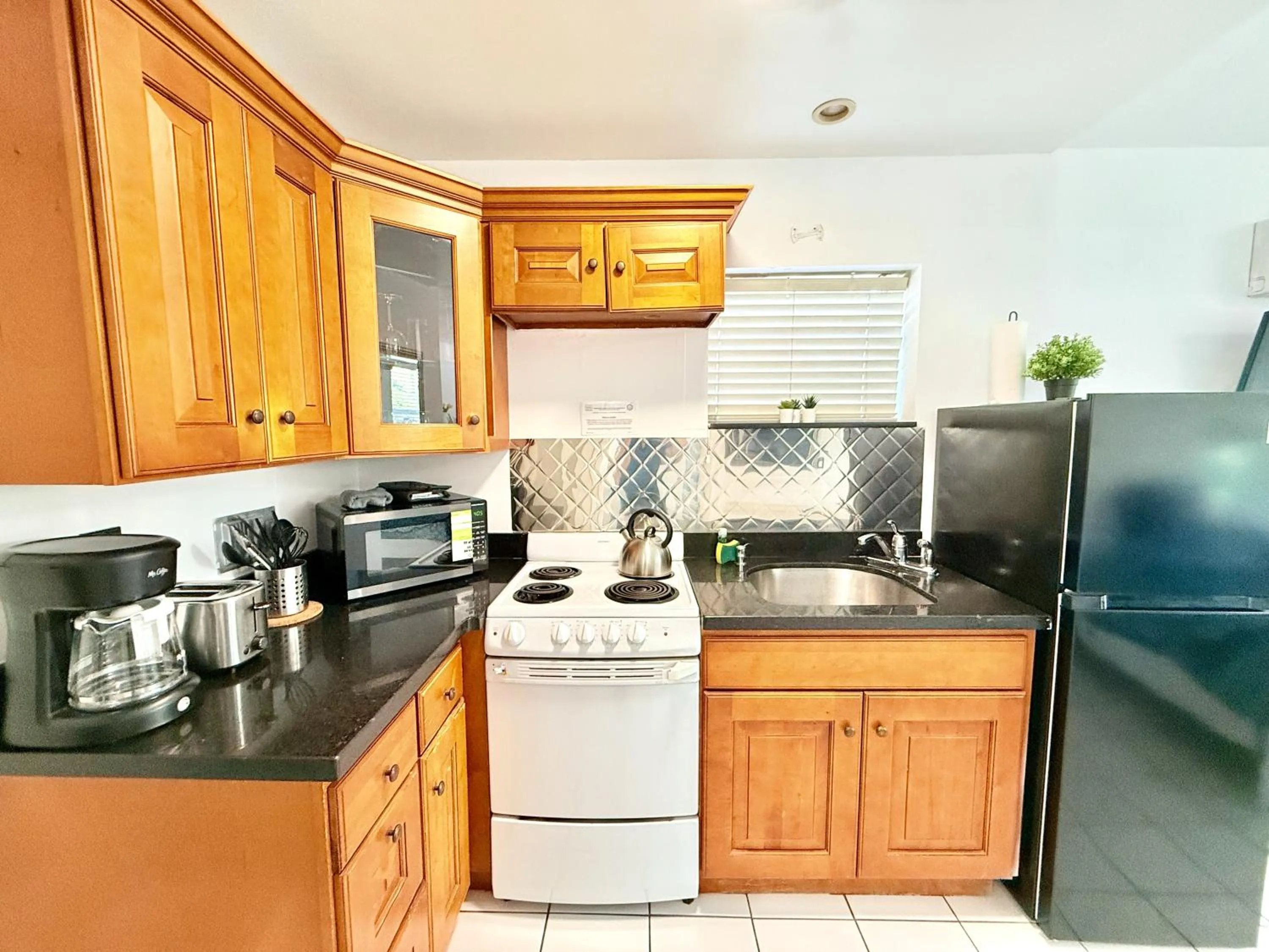 cot in Southwinds Inn by The Gold Nests