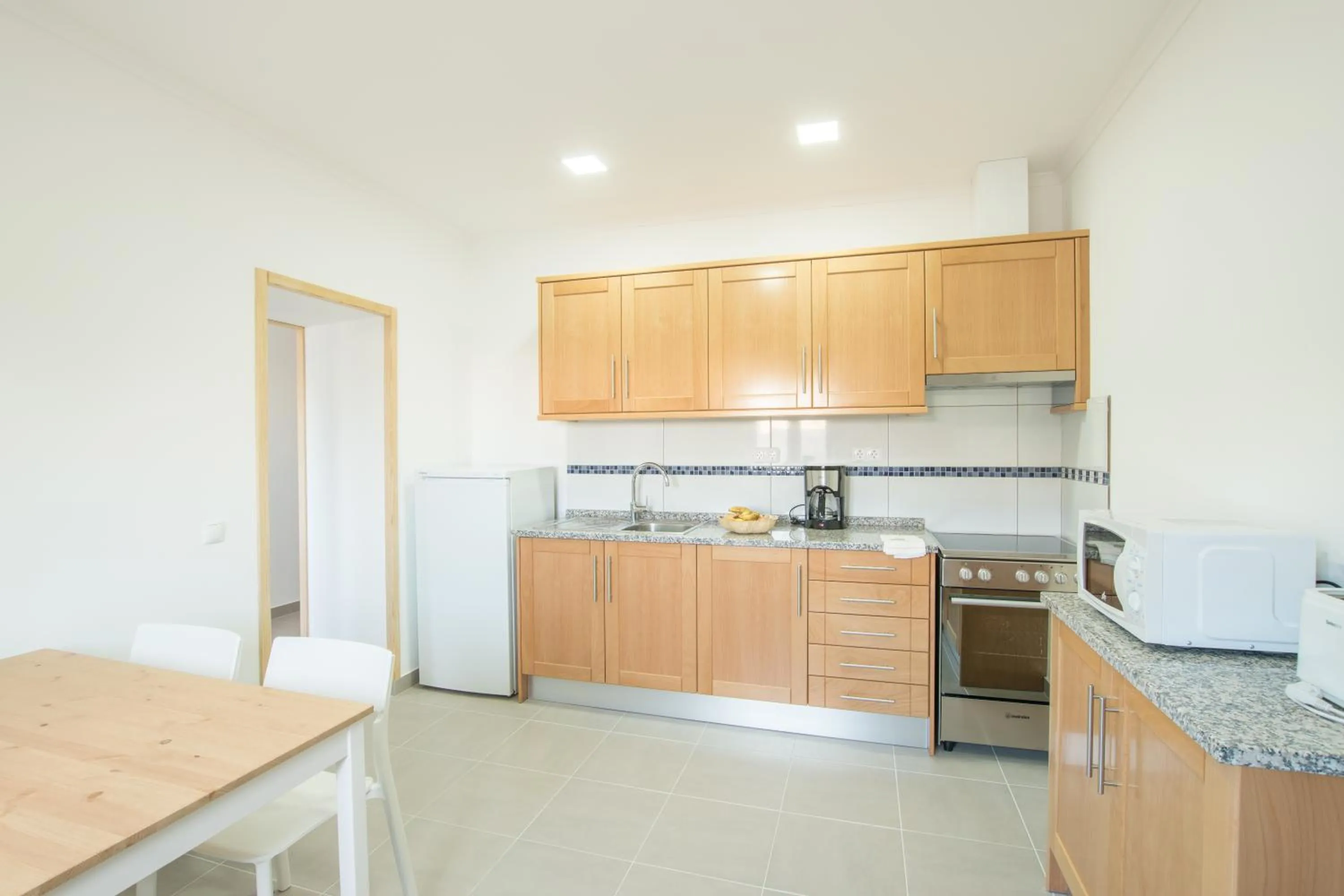 Kitchen or kitchenette in Tonel Apartamentos Turisticos