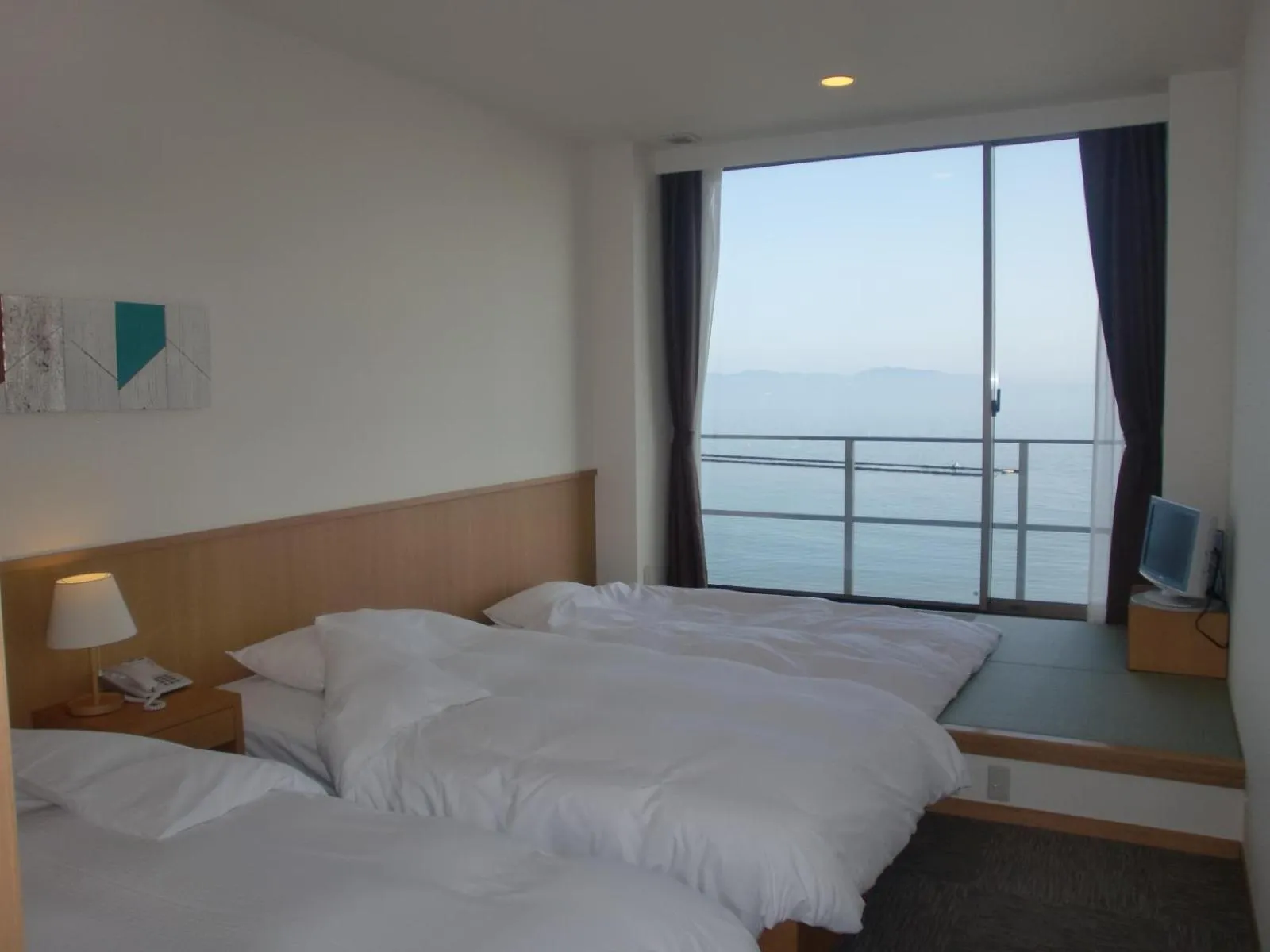 Photo of the whole room, Bed in Bayside Square Kaike Hotel