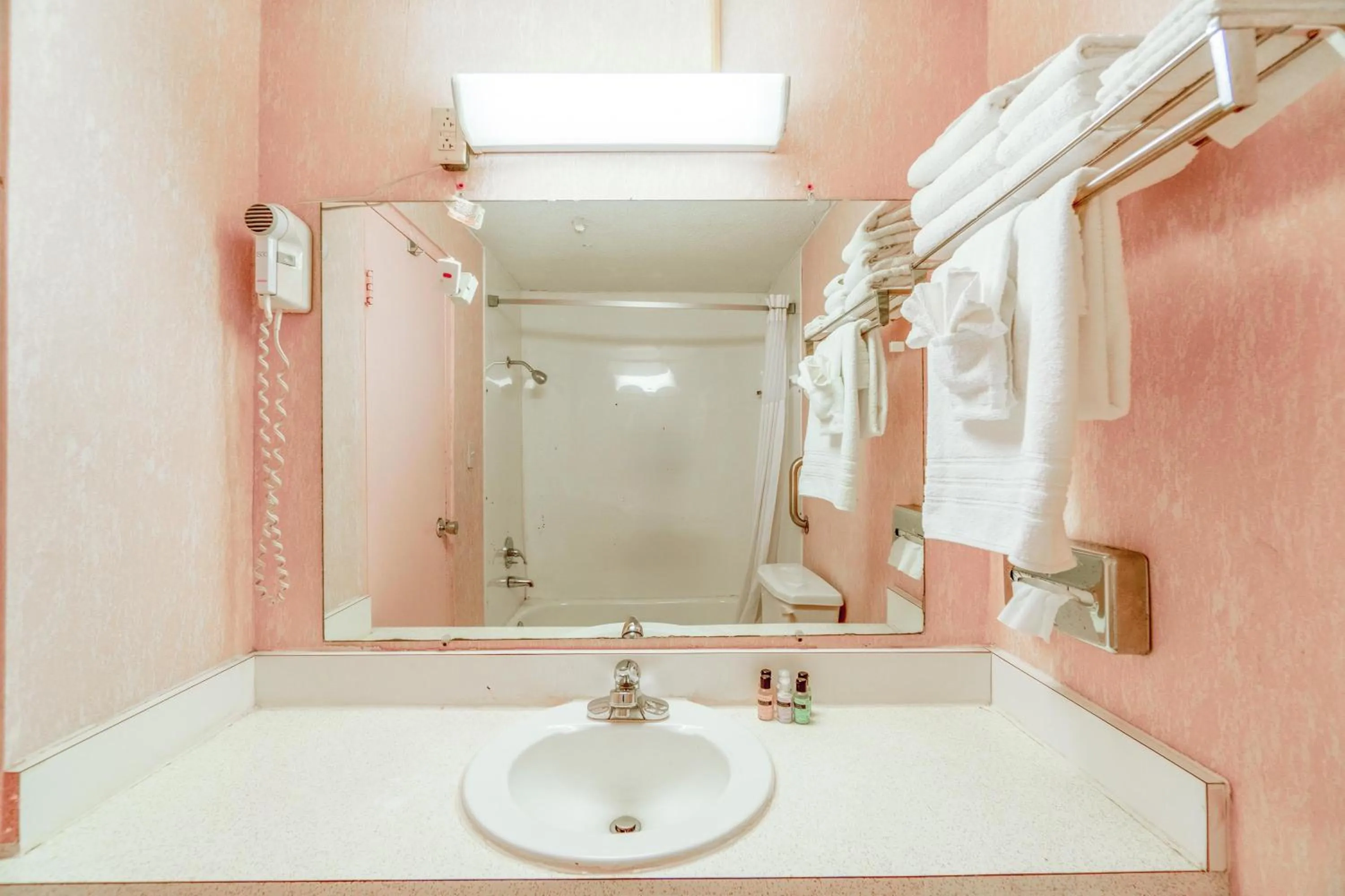 Bathroom in Ozark Junction mountain view by OYO