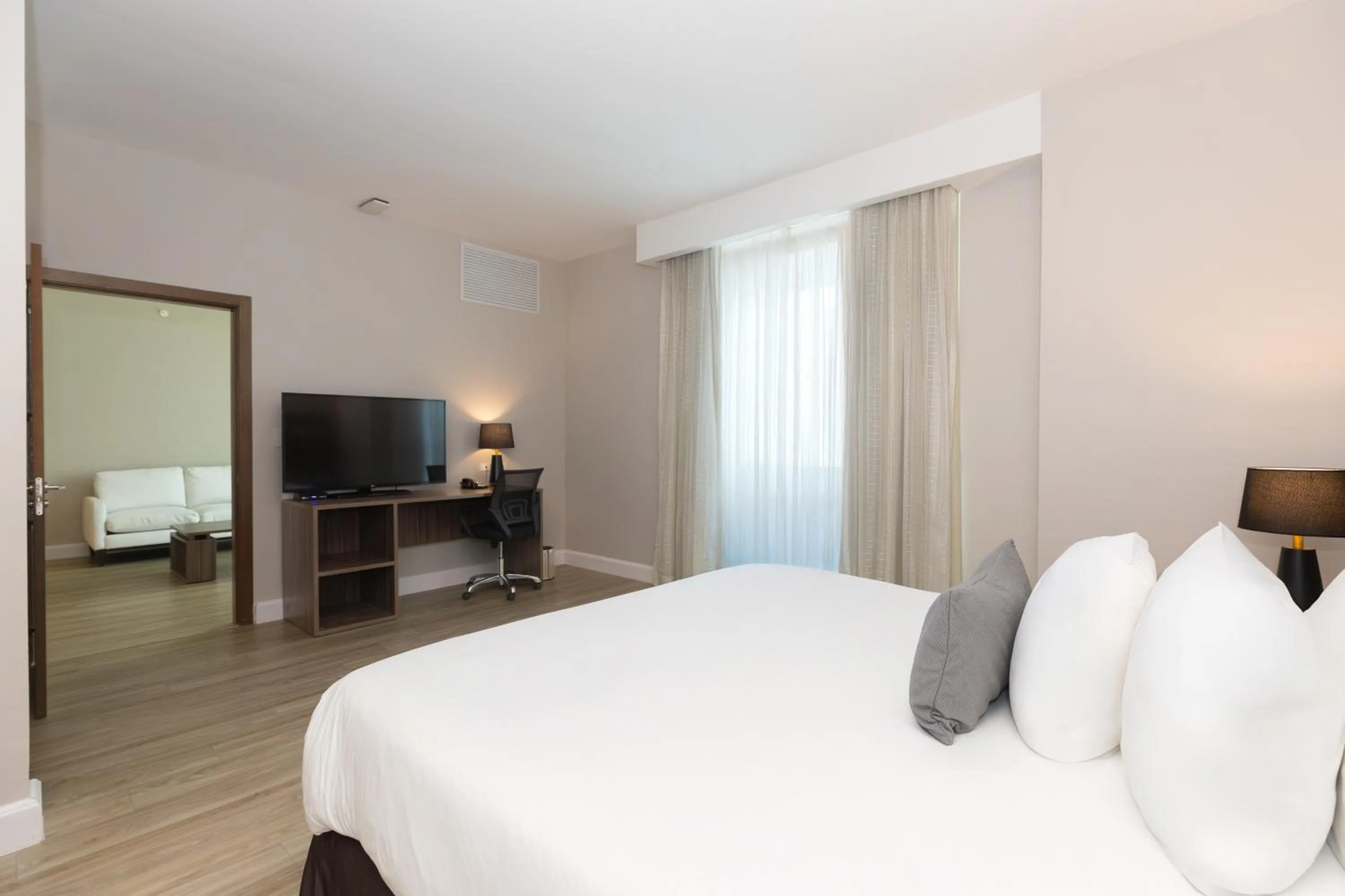 Bed in Victoria Hotel and Suites Panama