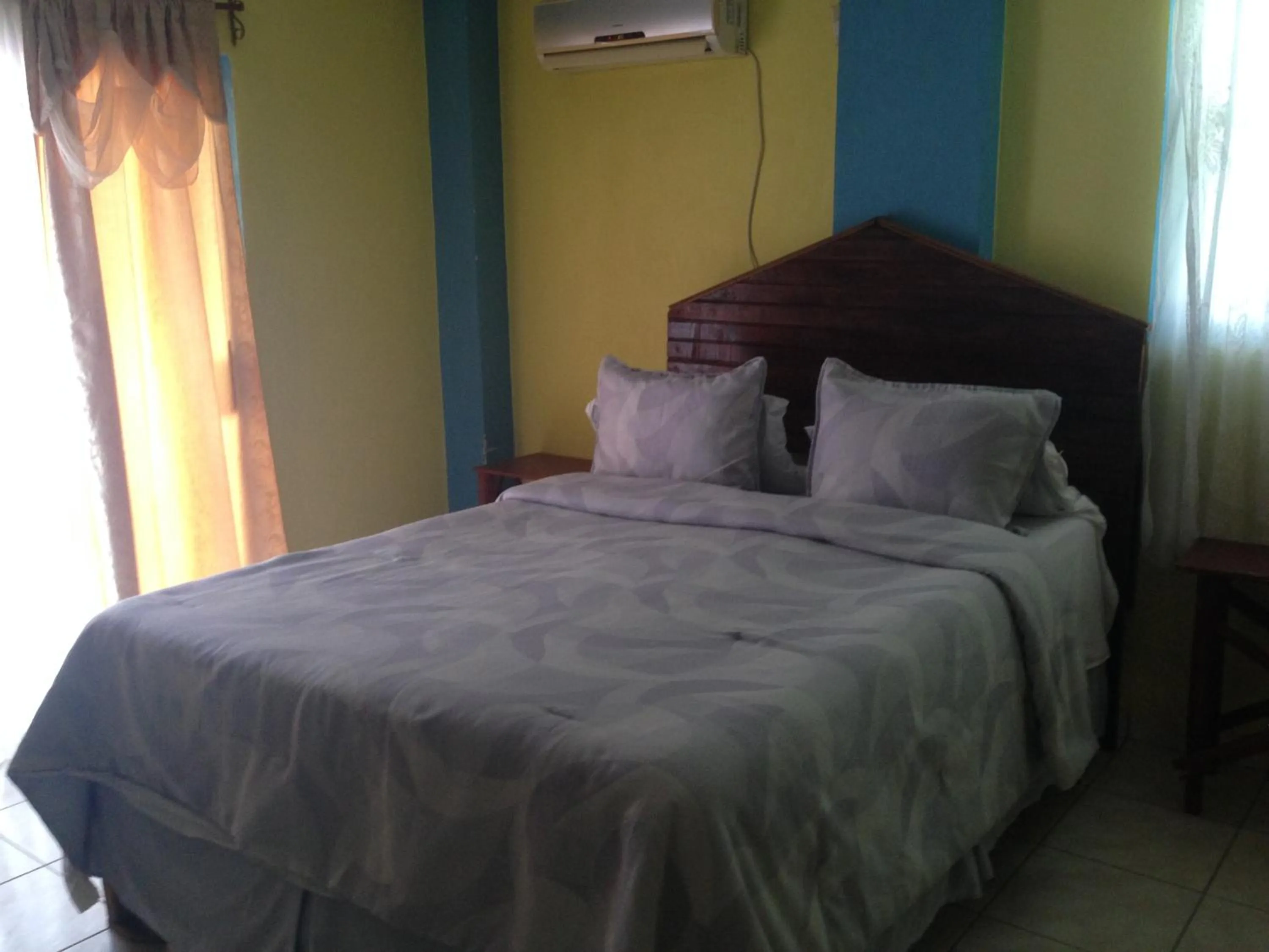 Bedroom in La Delphina Bed and Breakfast Bar and Grill