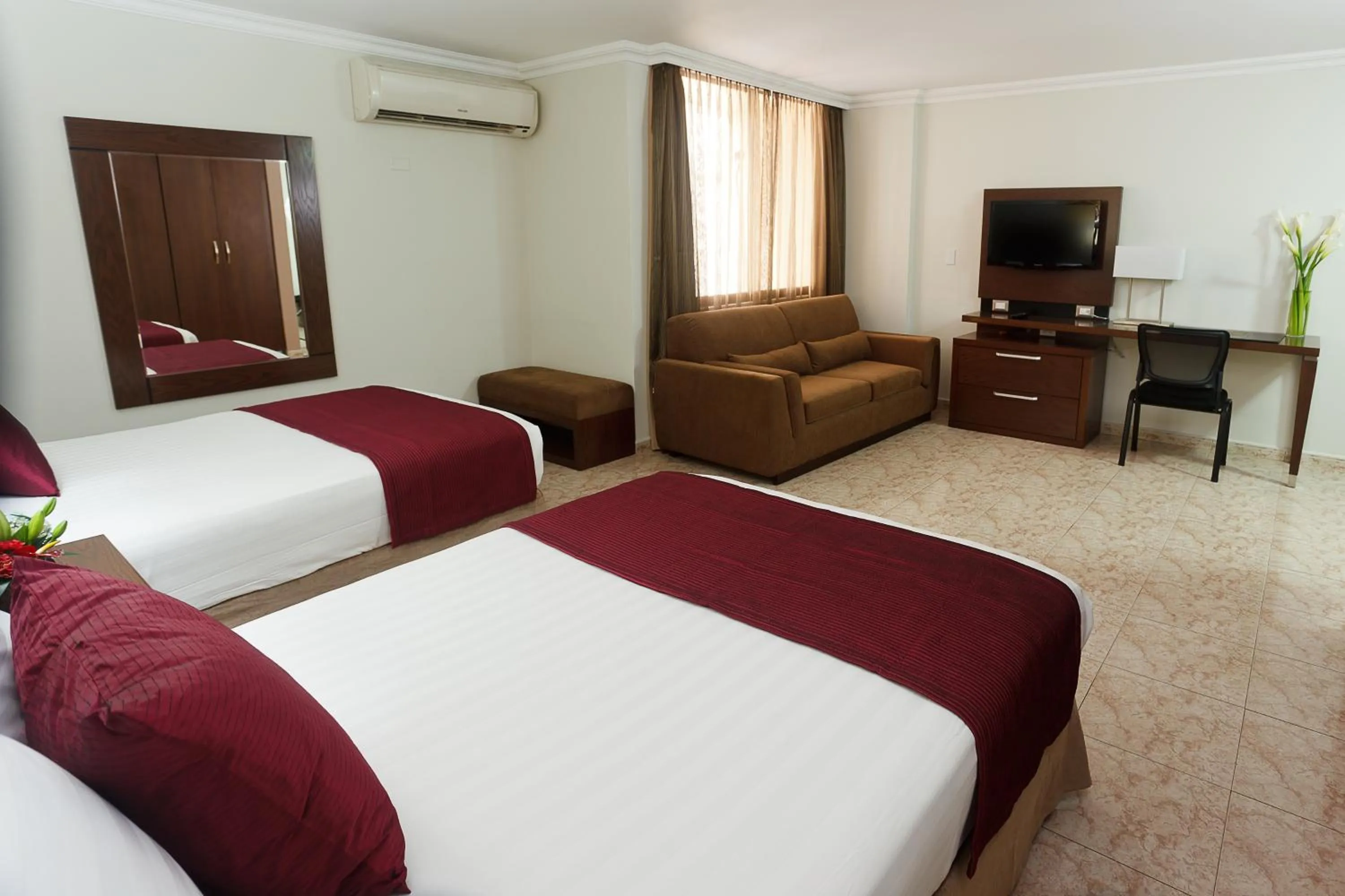 Bed in Hotel Coral Suites