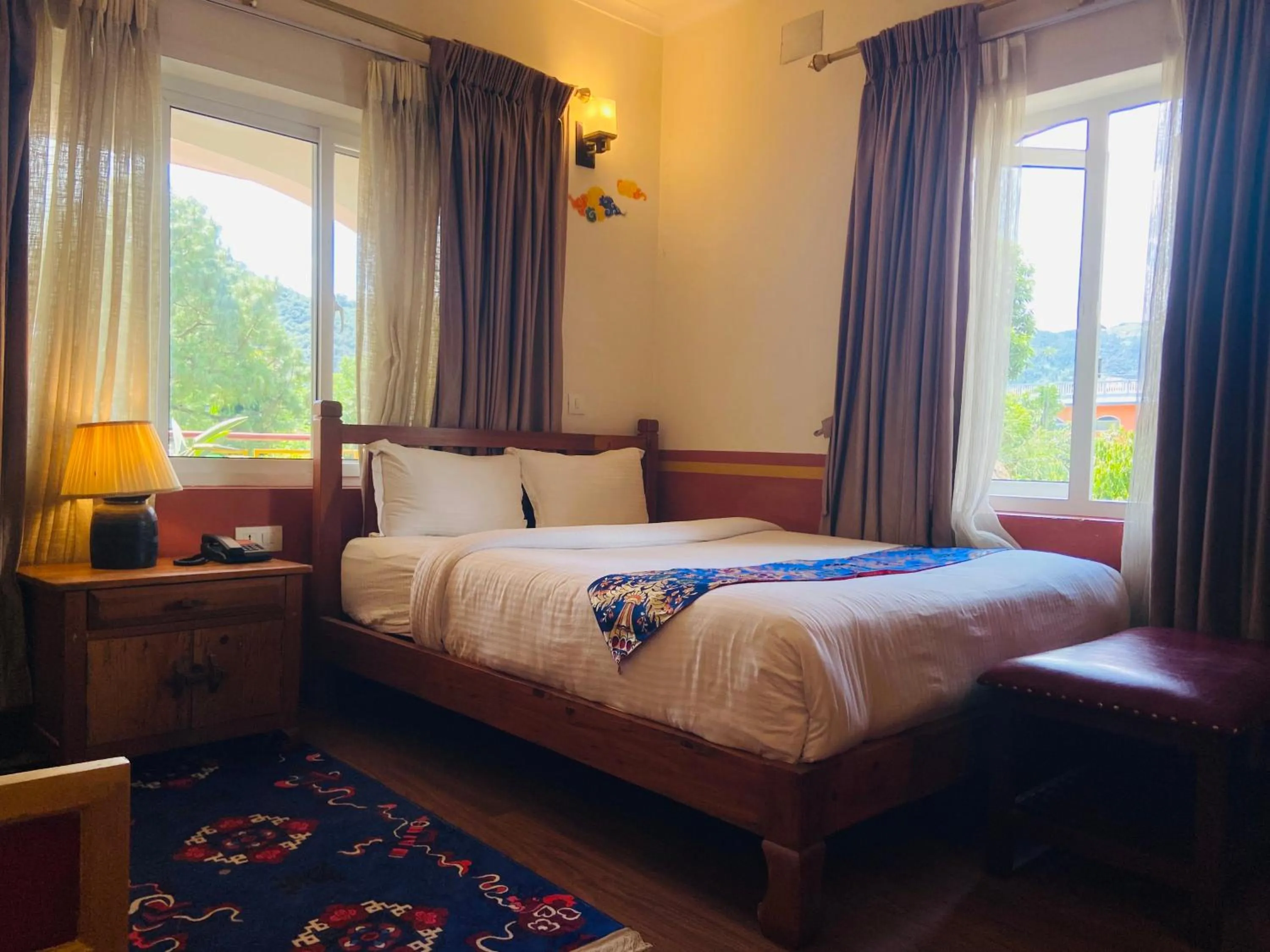 Bed in Three Jewels Boutique Hotel