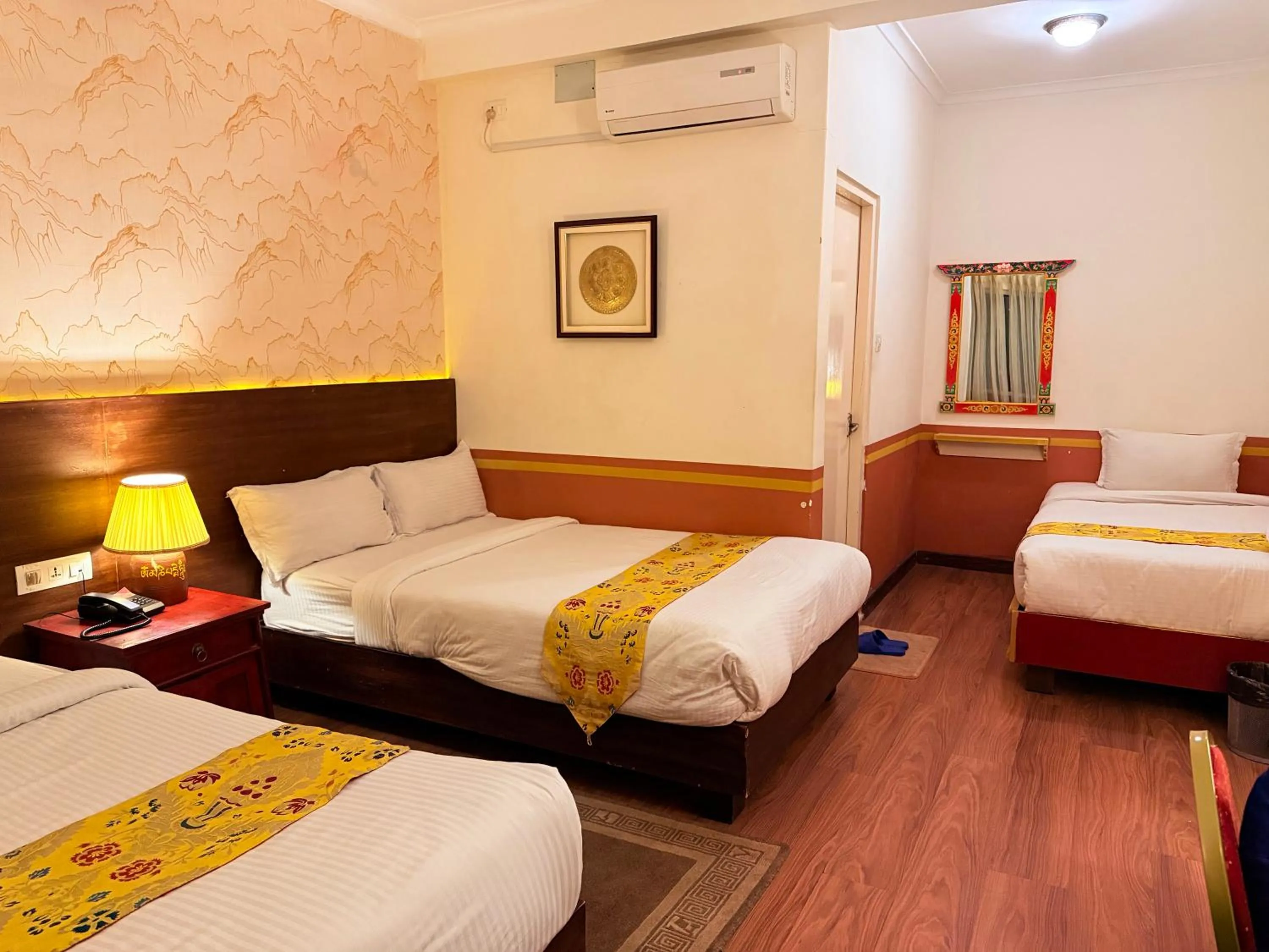 Bed in Three Jewels Boutique Hotel