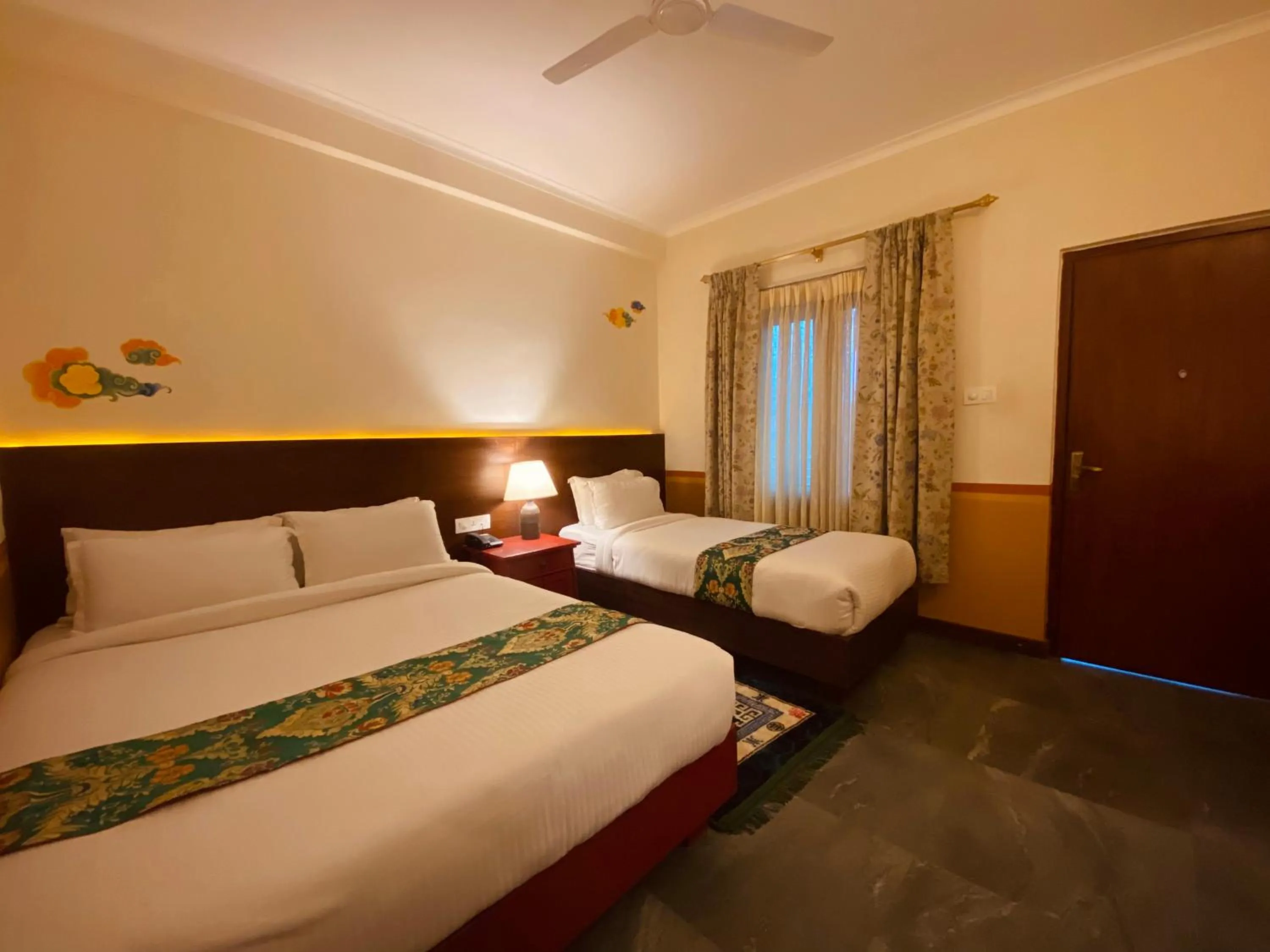 Bed in Three Jewels Boutique Hotel