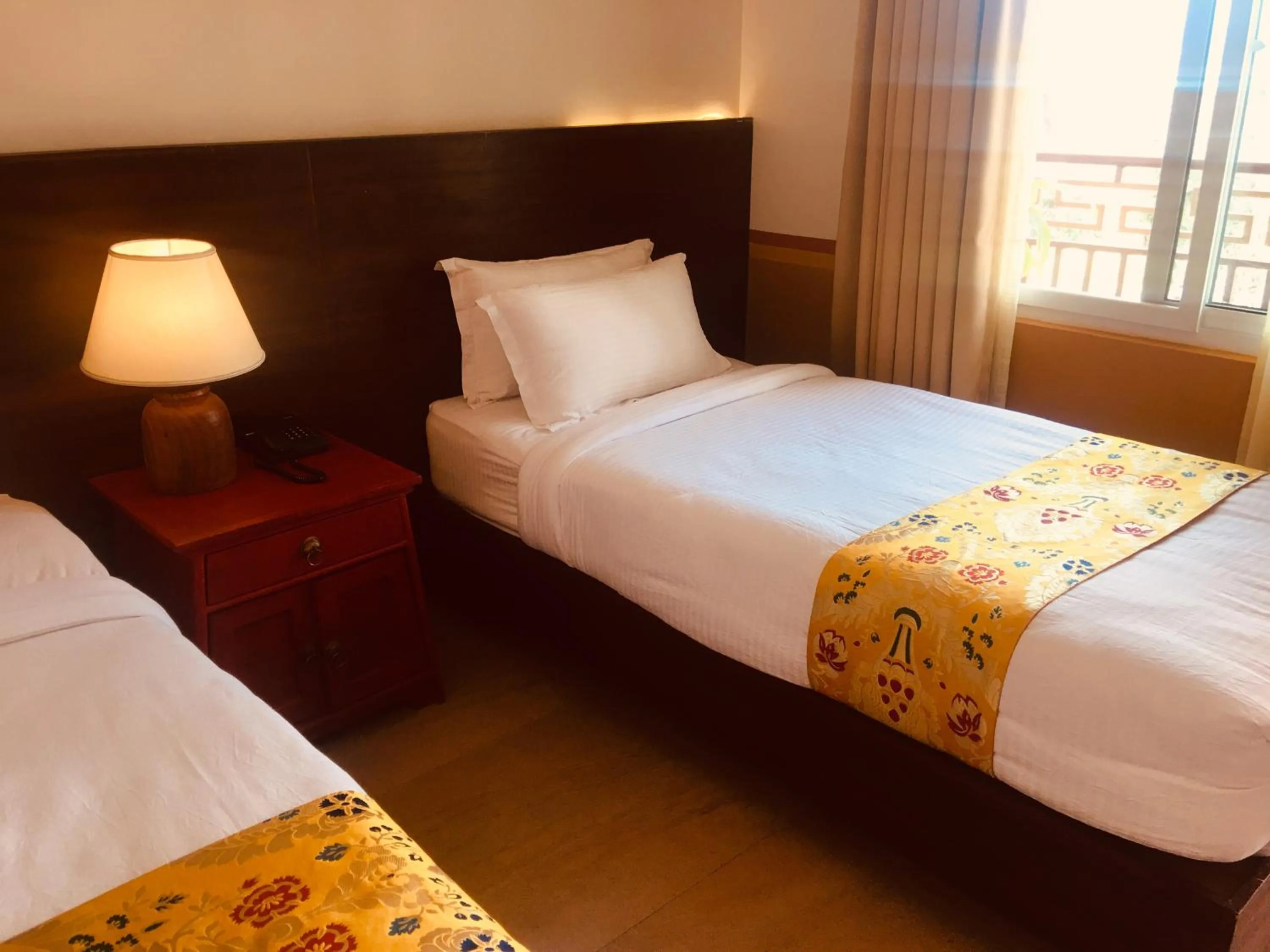 Bed in Three Jewels Boutique Hotel