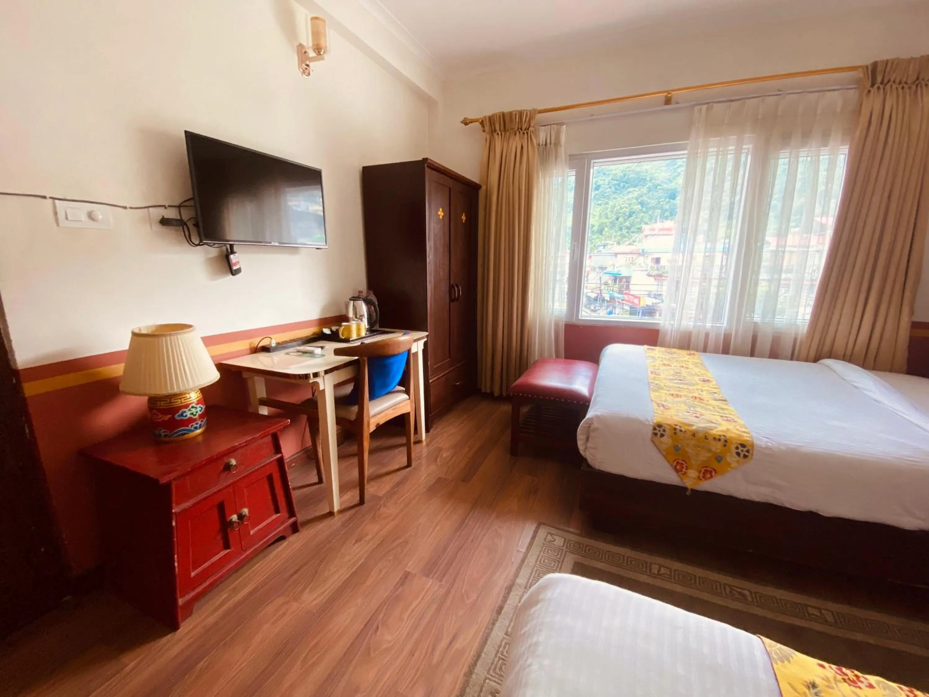 Bed in Three Jewels Boutique Hotel