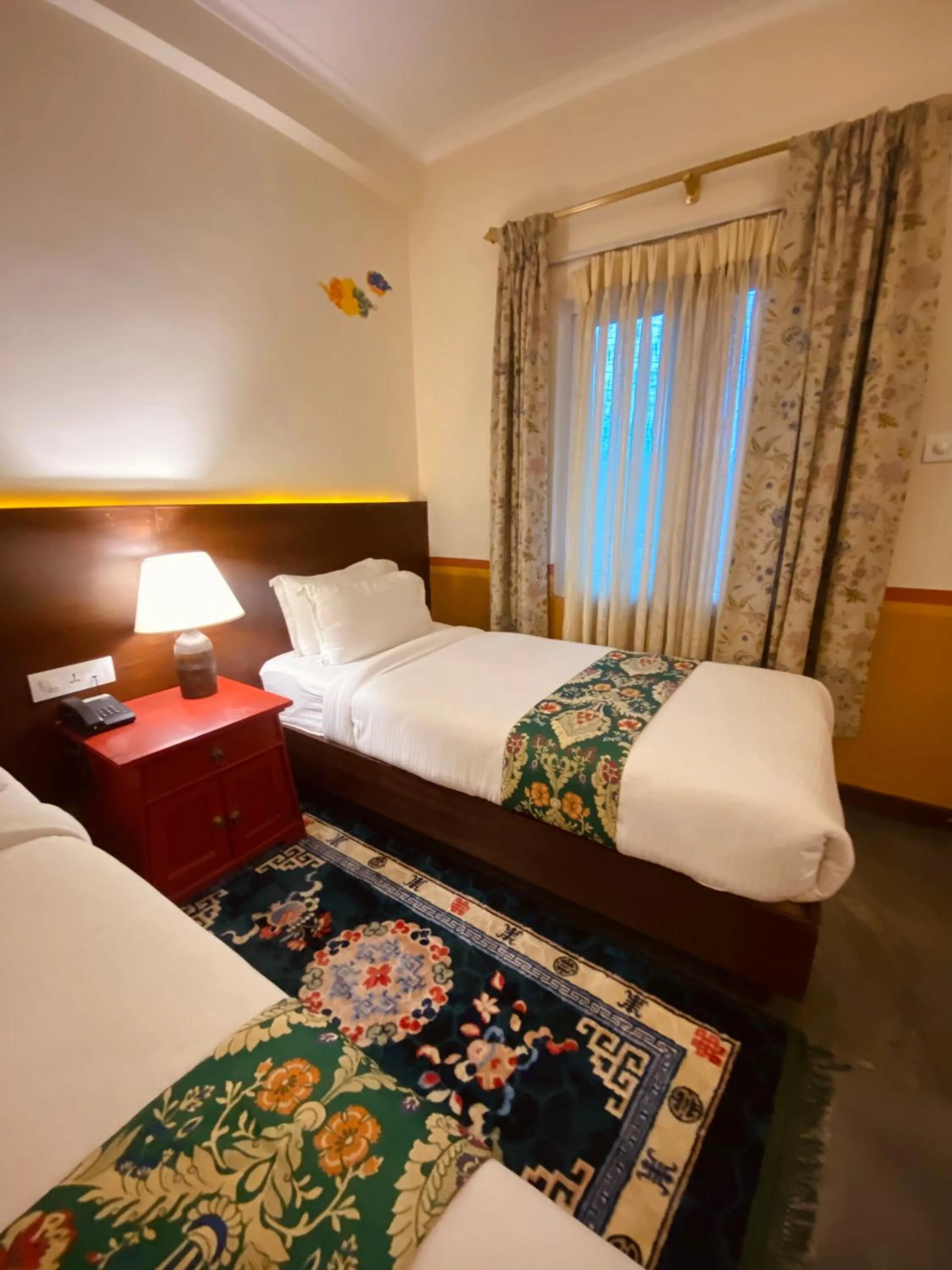 Bed in Three Jewels Boutique Hotel