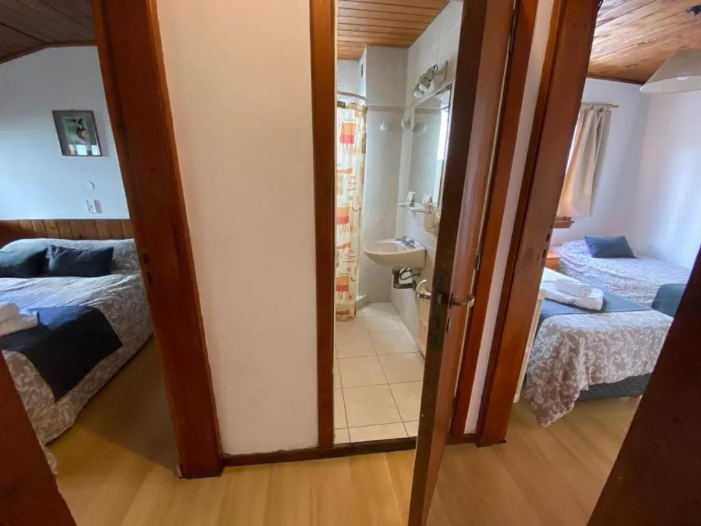 Bed in Hostería Suiza - Ex Casita Suiza