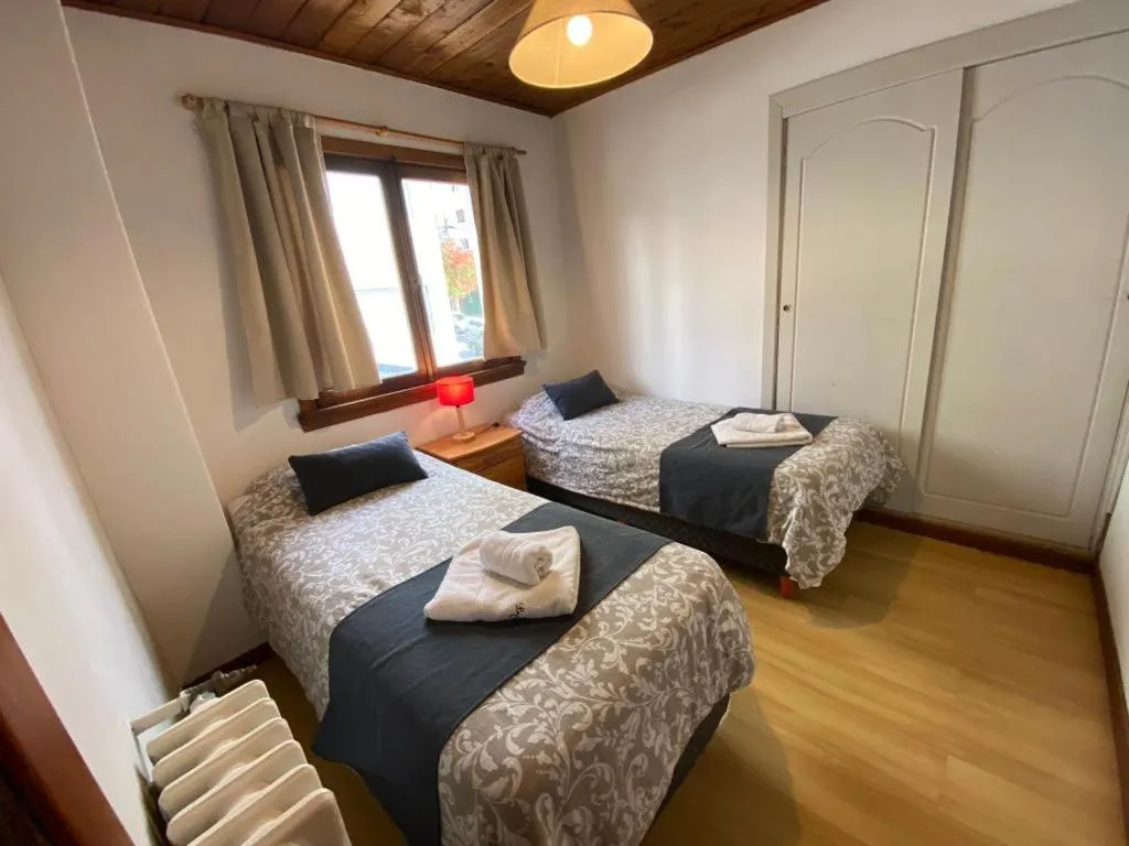 Bed in Hostería Suiza - Ex Casita Suiza
