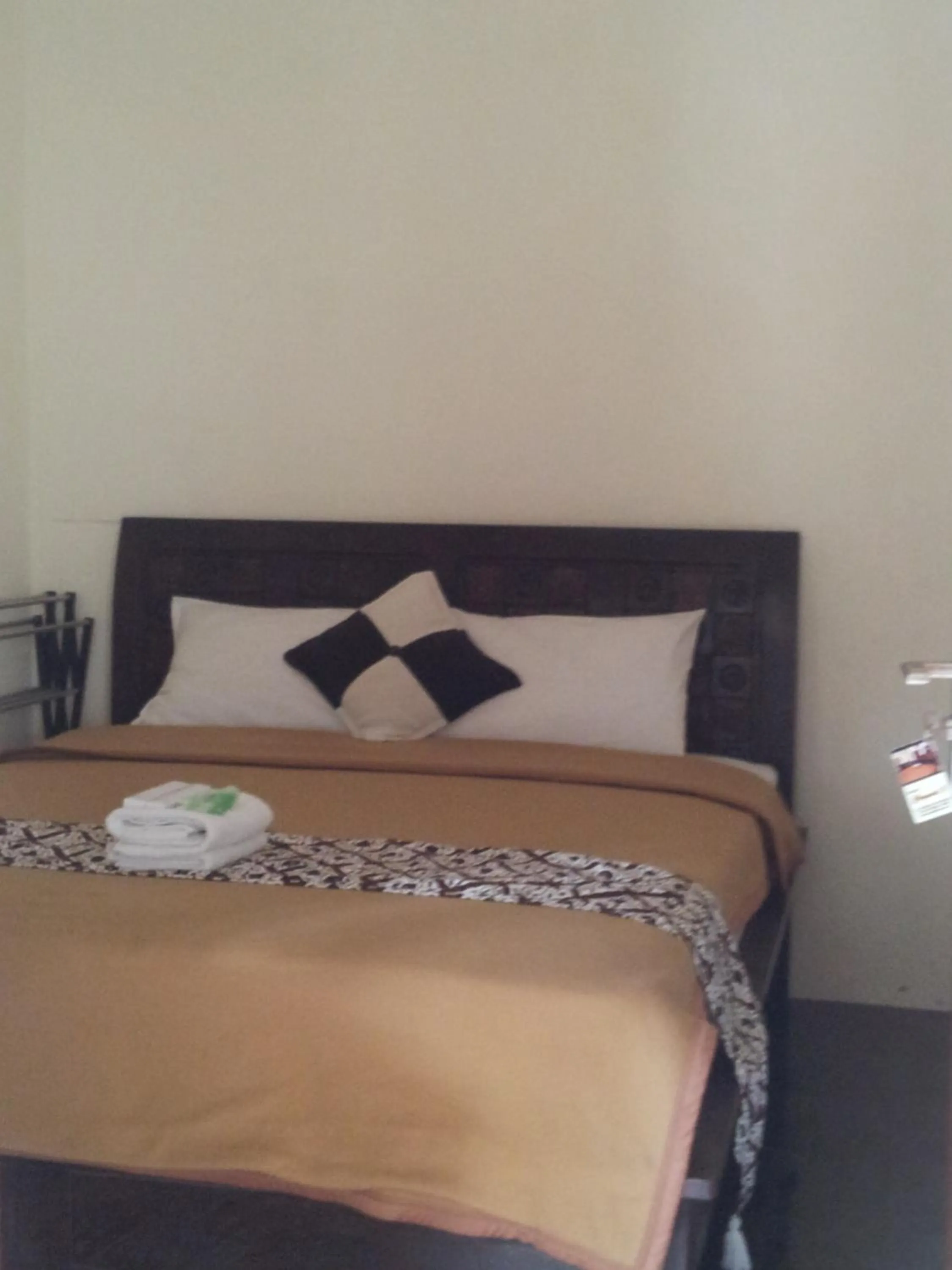 Bed in Ndalem Suratin Guesthouse