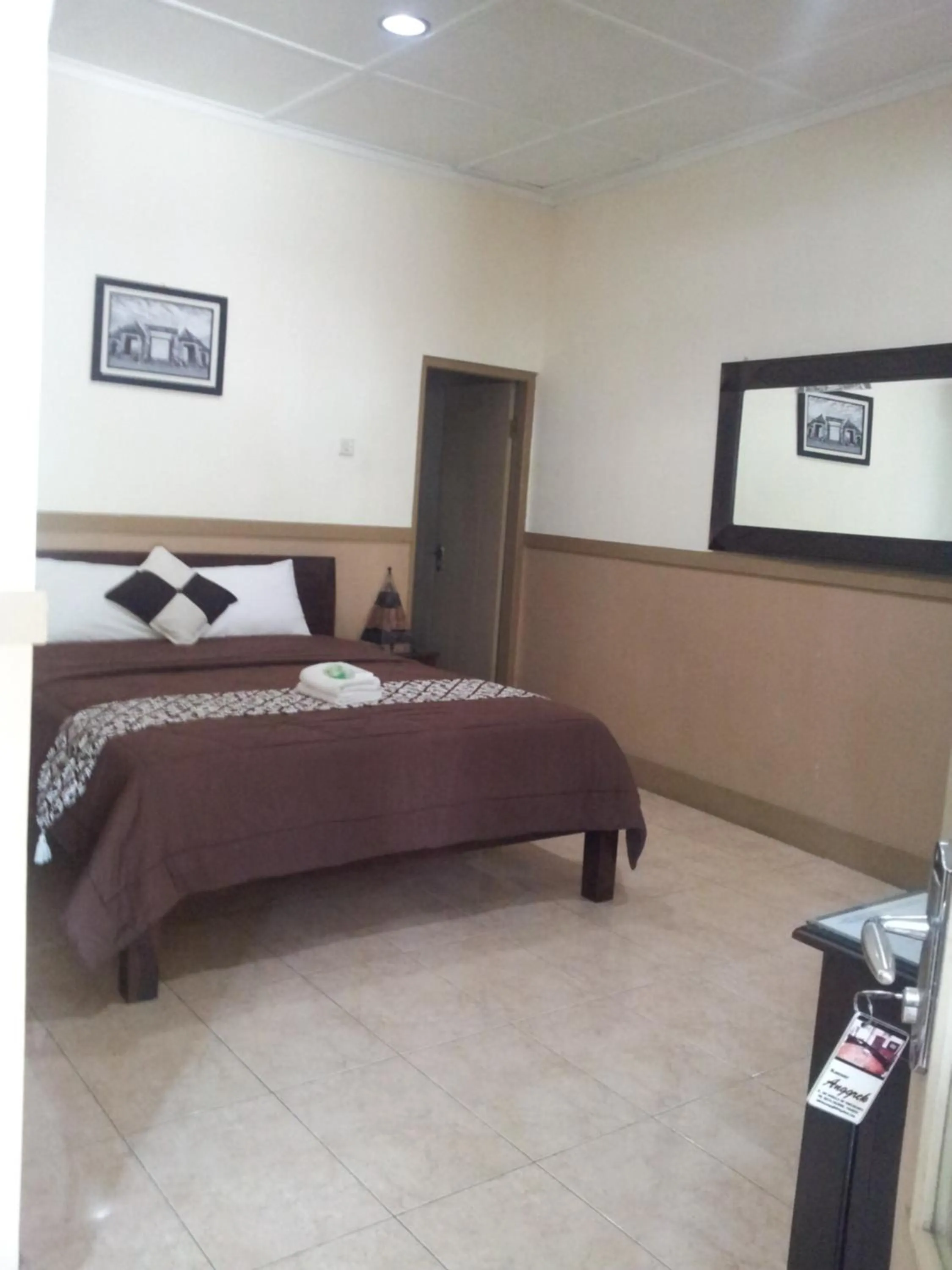 Bed in Ndalem Suratin Guesthouse