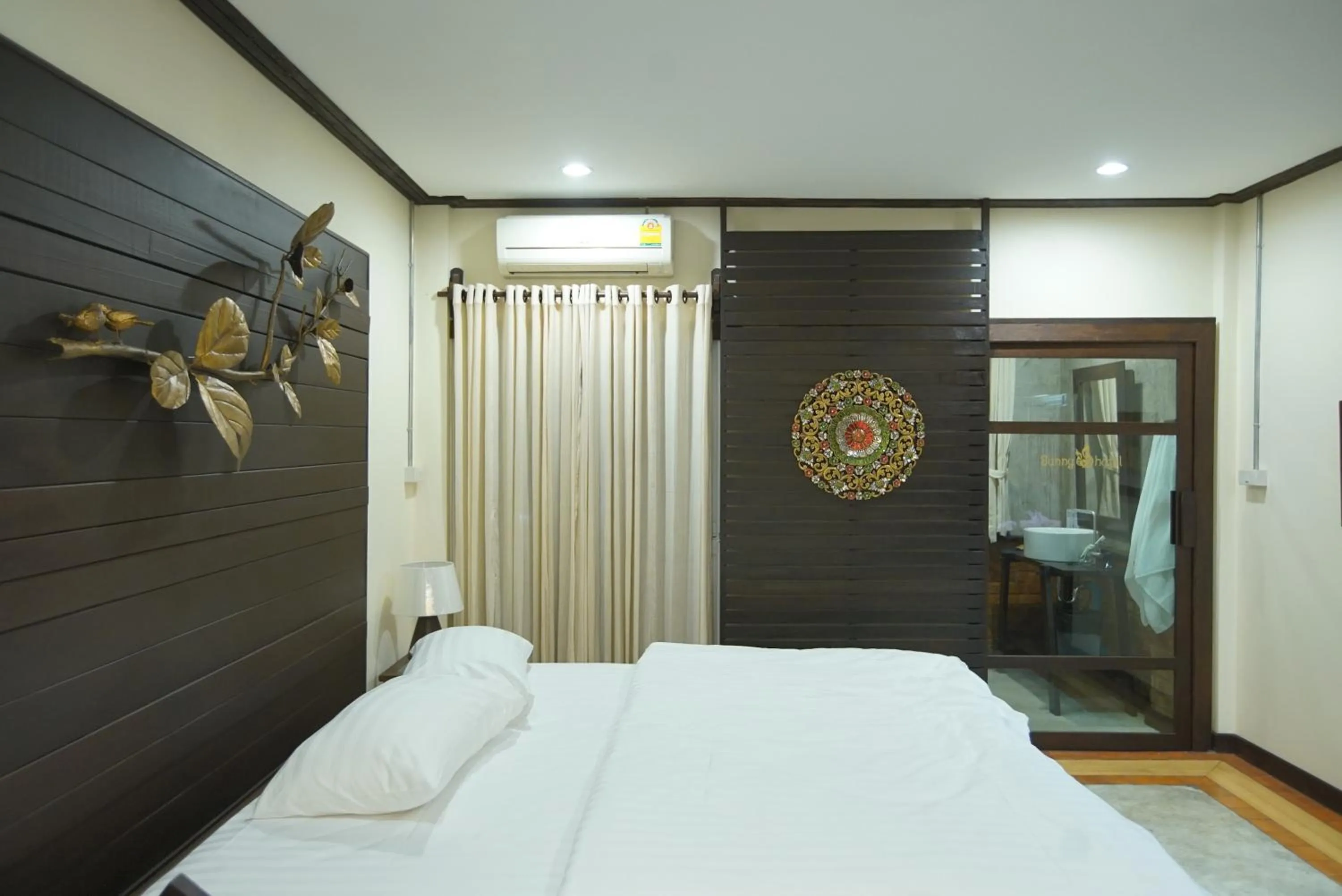 Bed in Sunny V Hotel