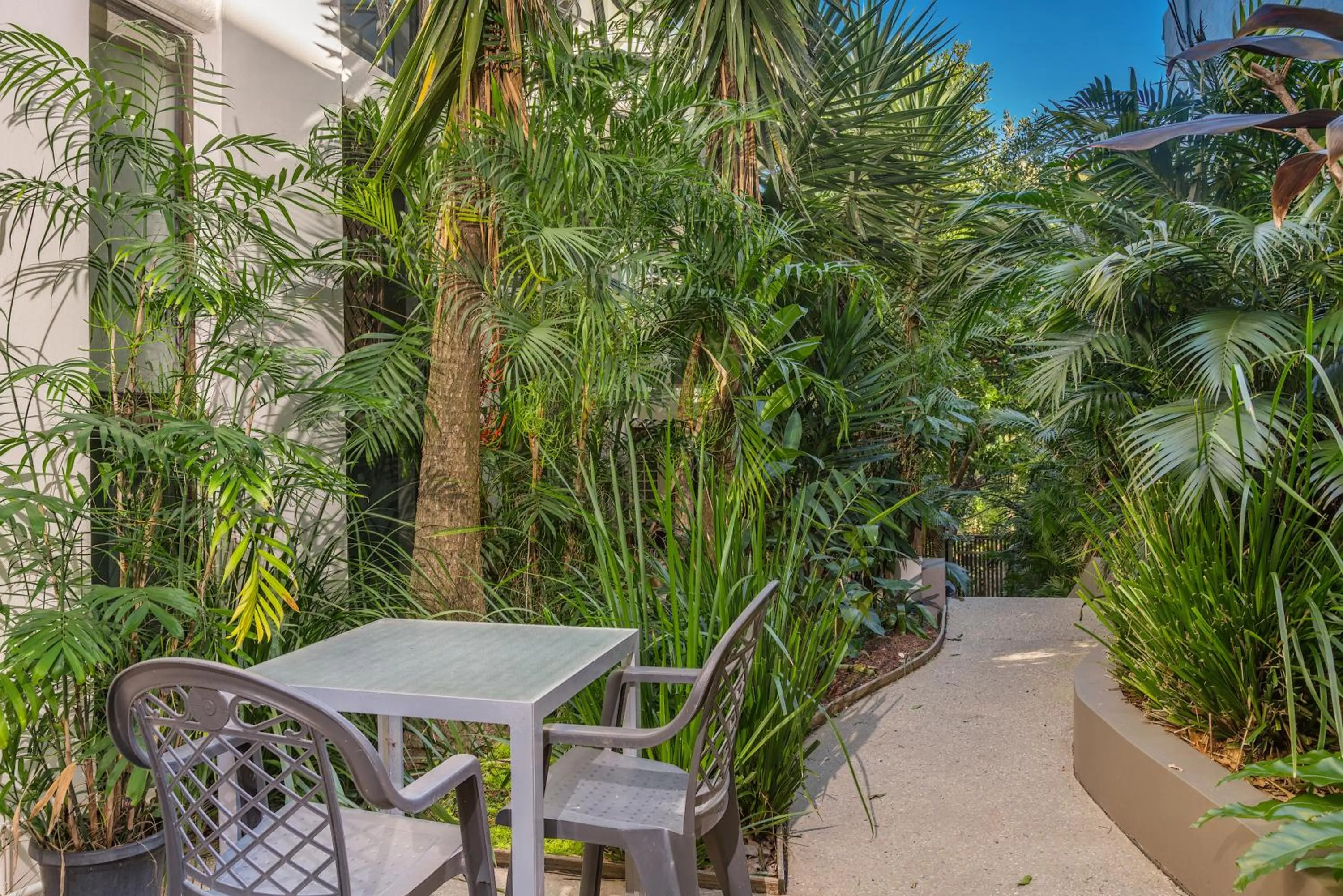 Garden in Bayview Beachfront Apartments, in town right on the beach