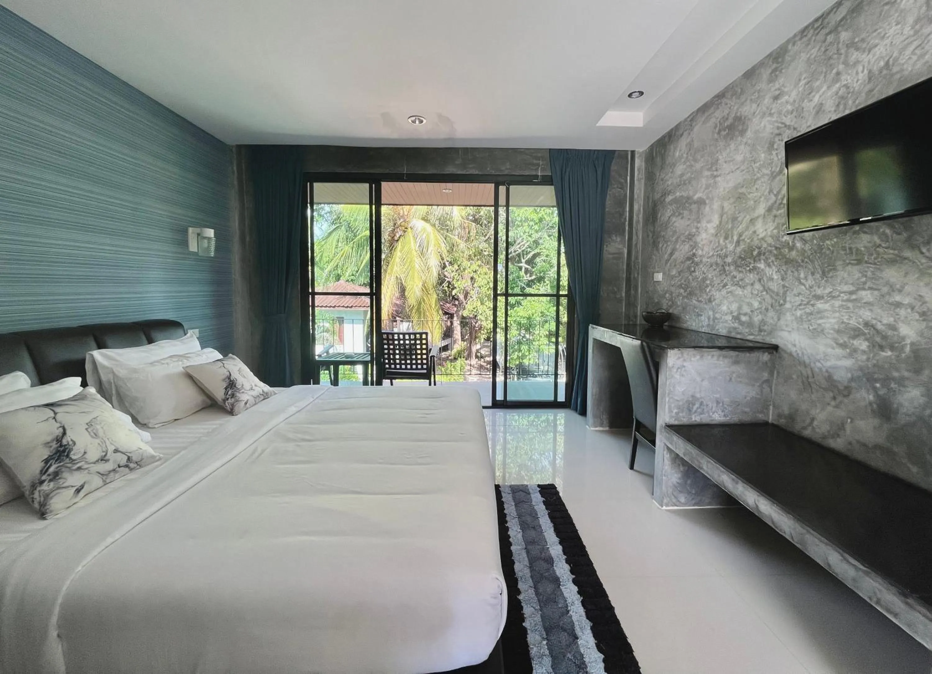 Bed in Sabaii Bay Resort