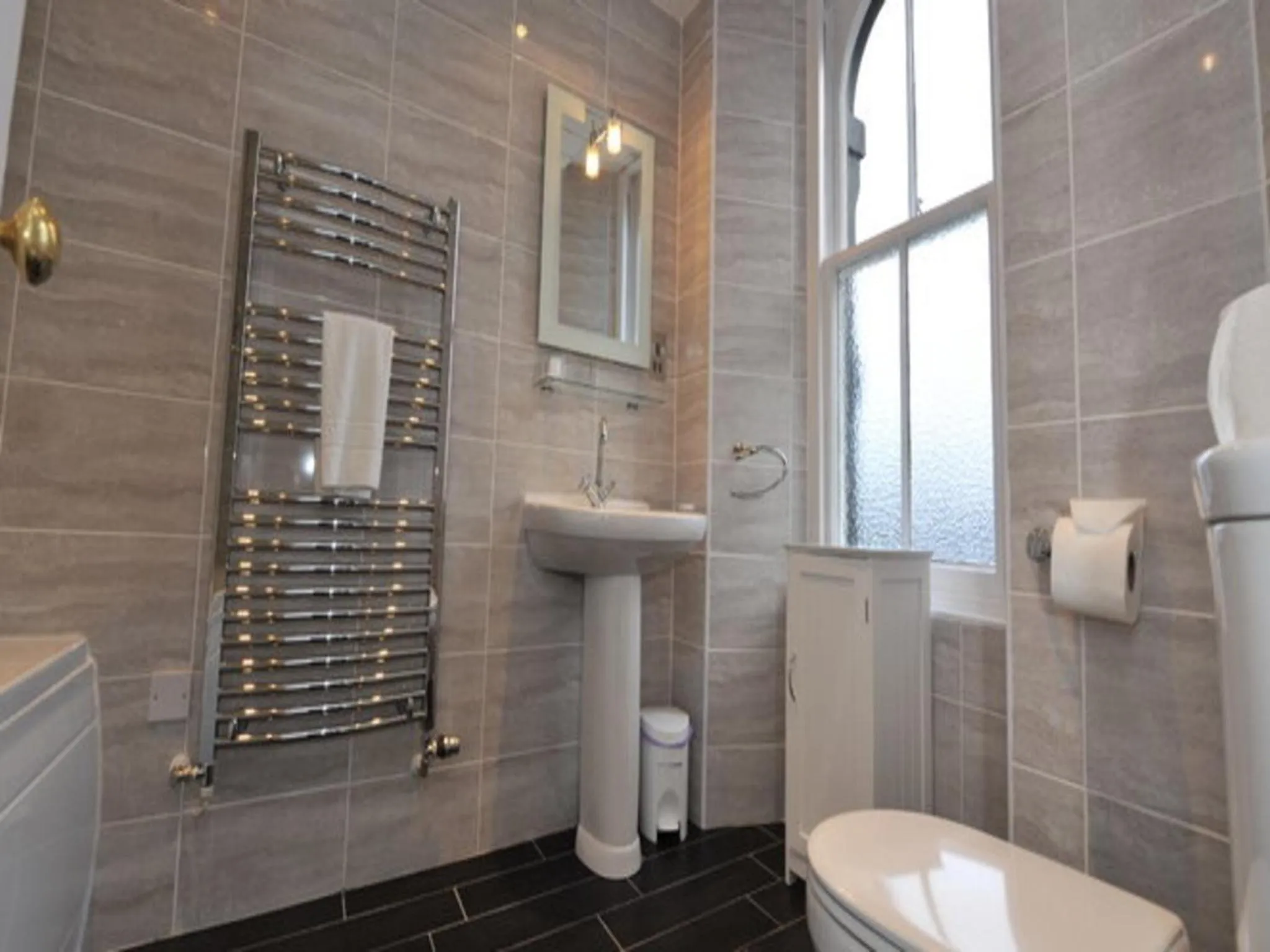 Bathroom in Poppies Hotel