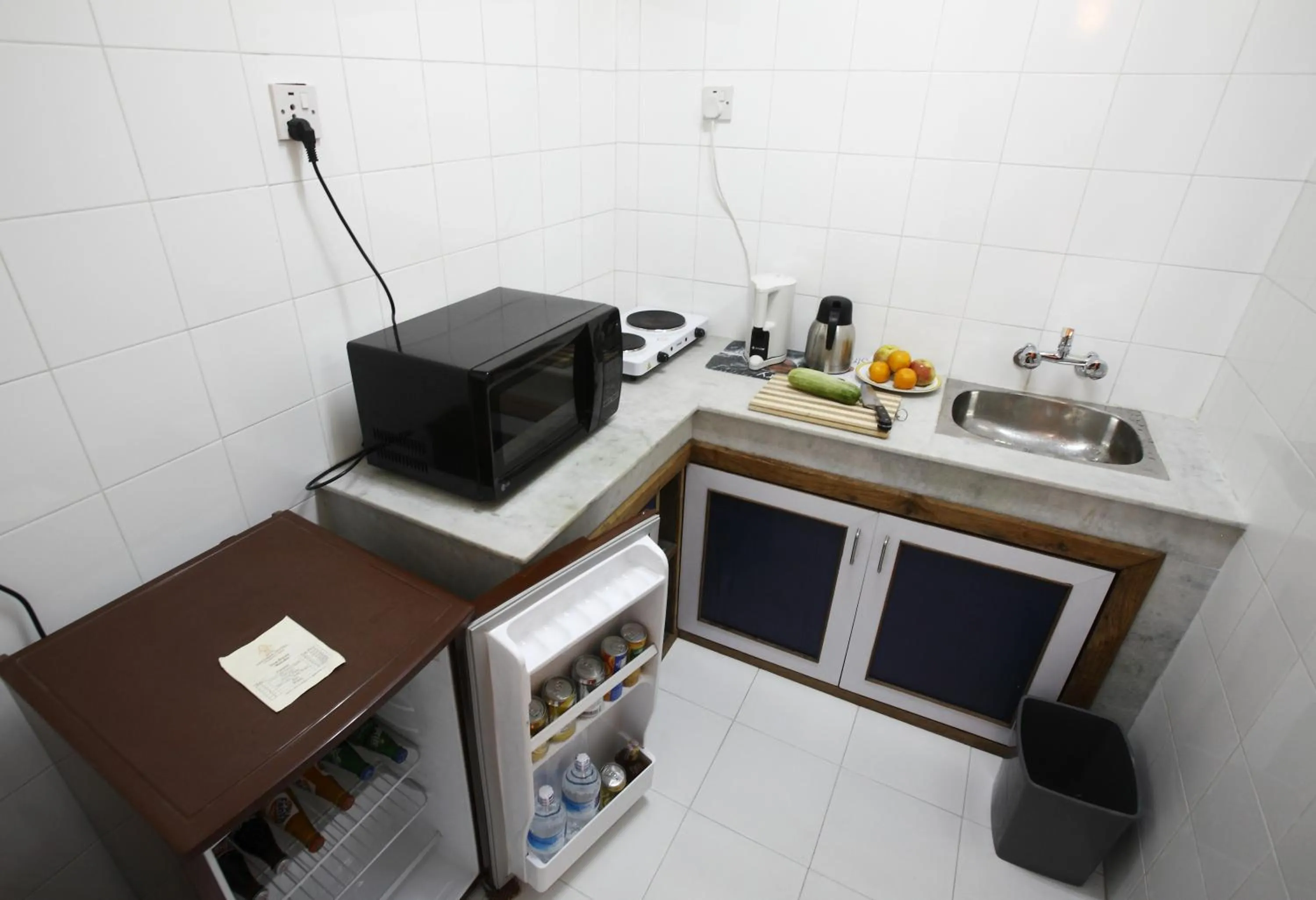 Kitchen or kitchenette in Royal Astoria Hotel
