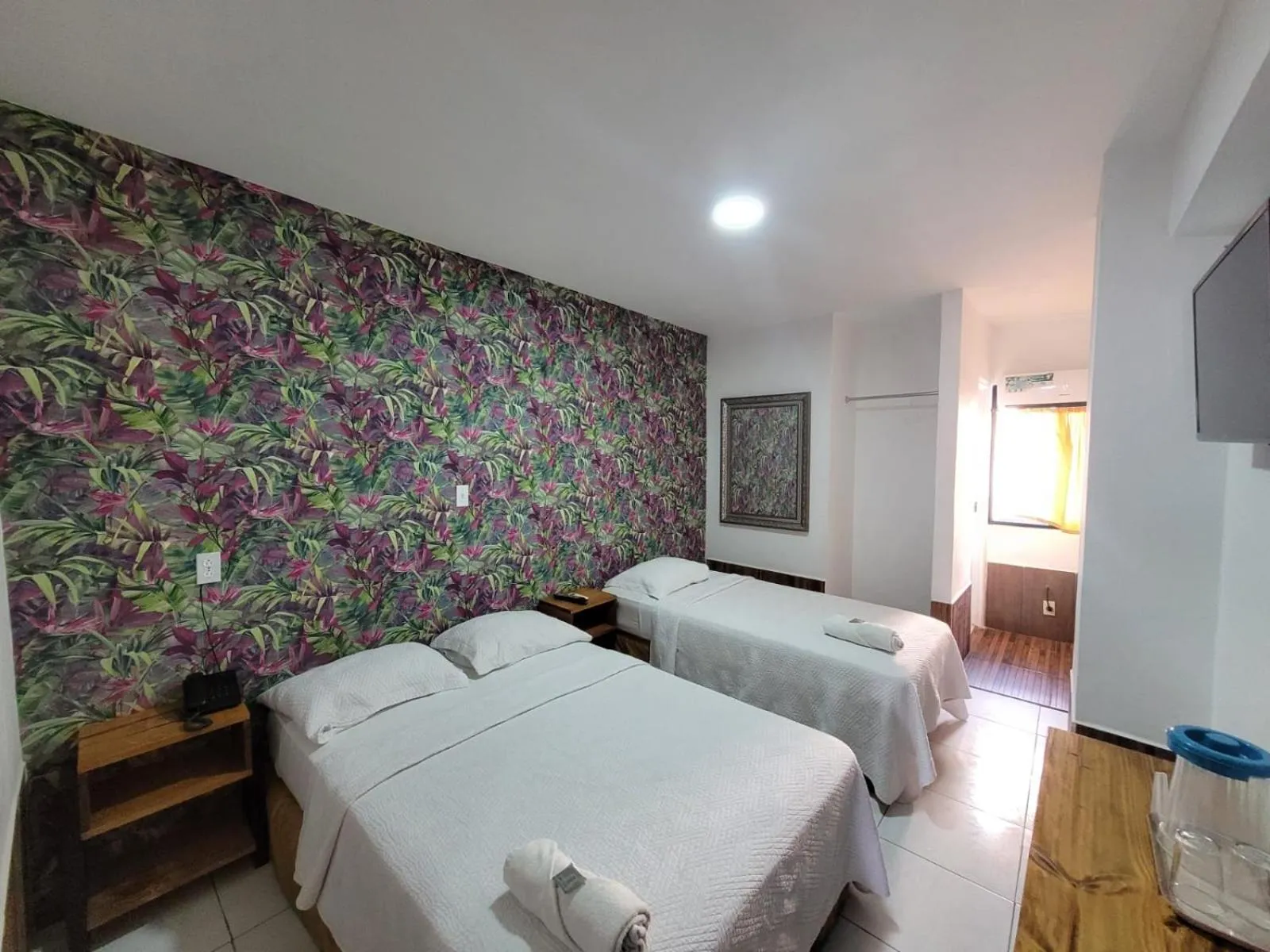 Bed in Hotel Costa Inn