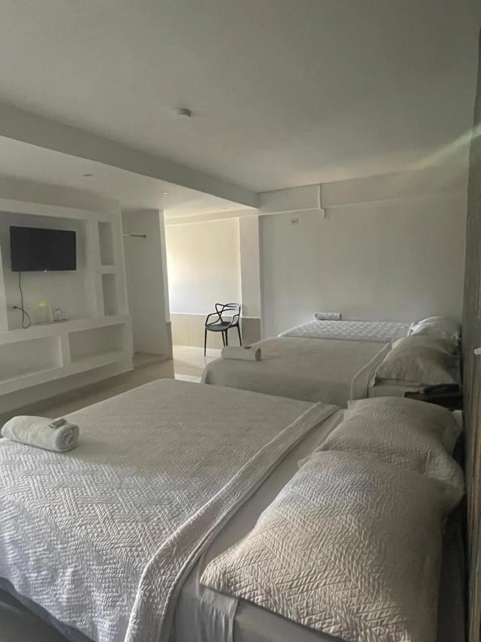 Bed in Hotel Costa Inn