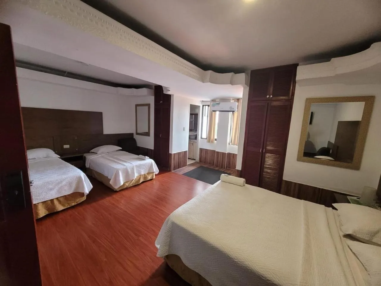 Bed in Hotel Costa Inn