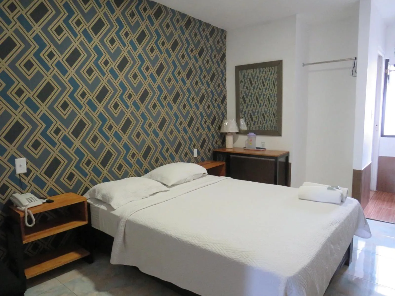 Bed in Hotel Costa Inn