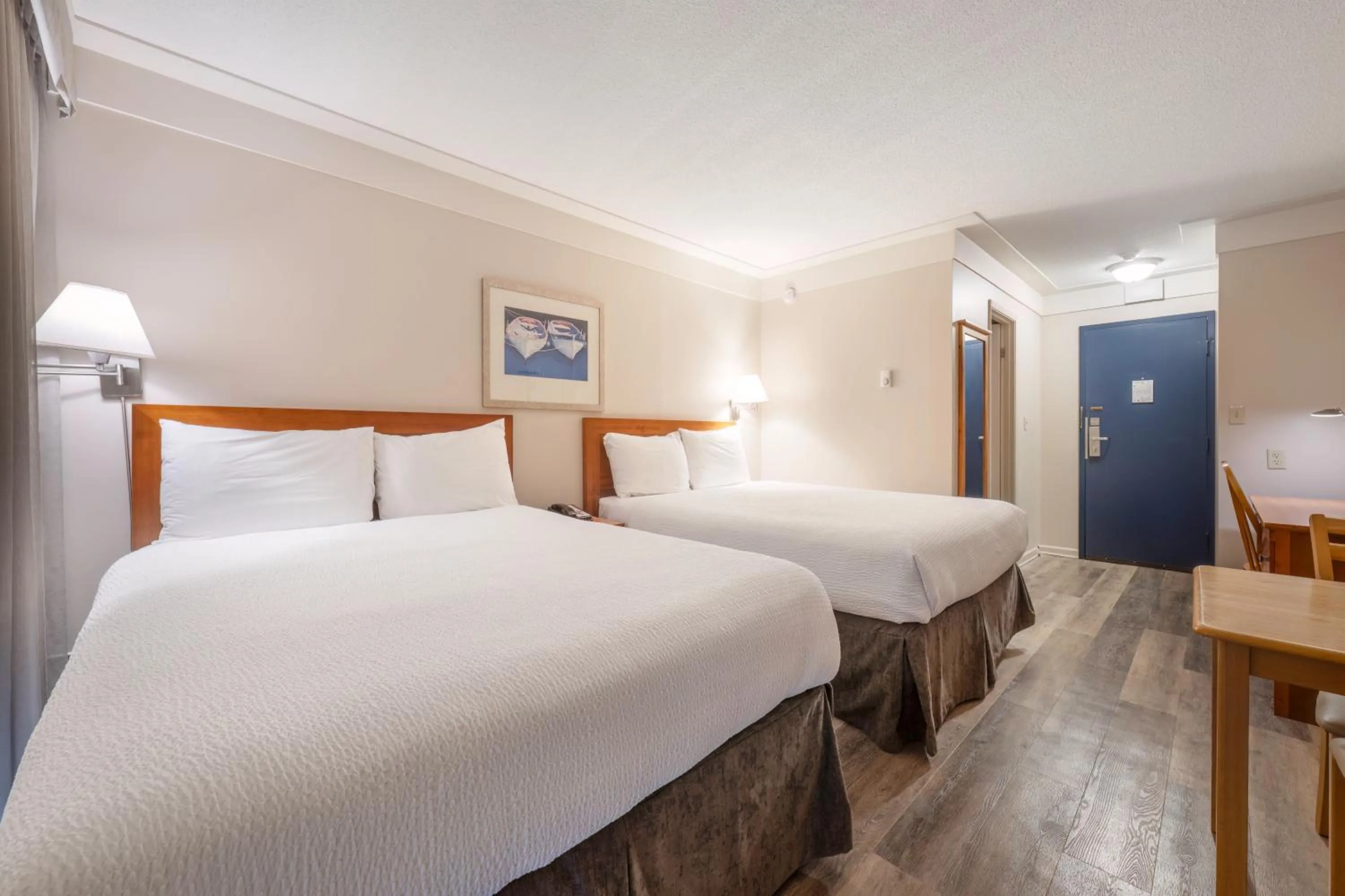 Bed in Sidney Waterfront Inn & Suites