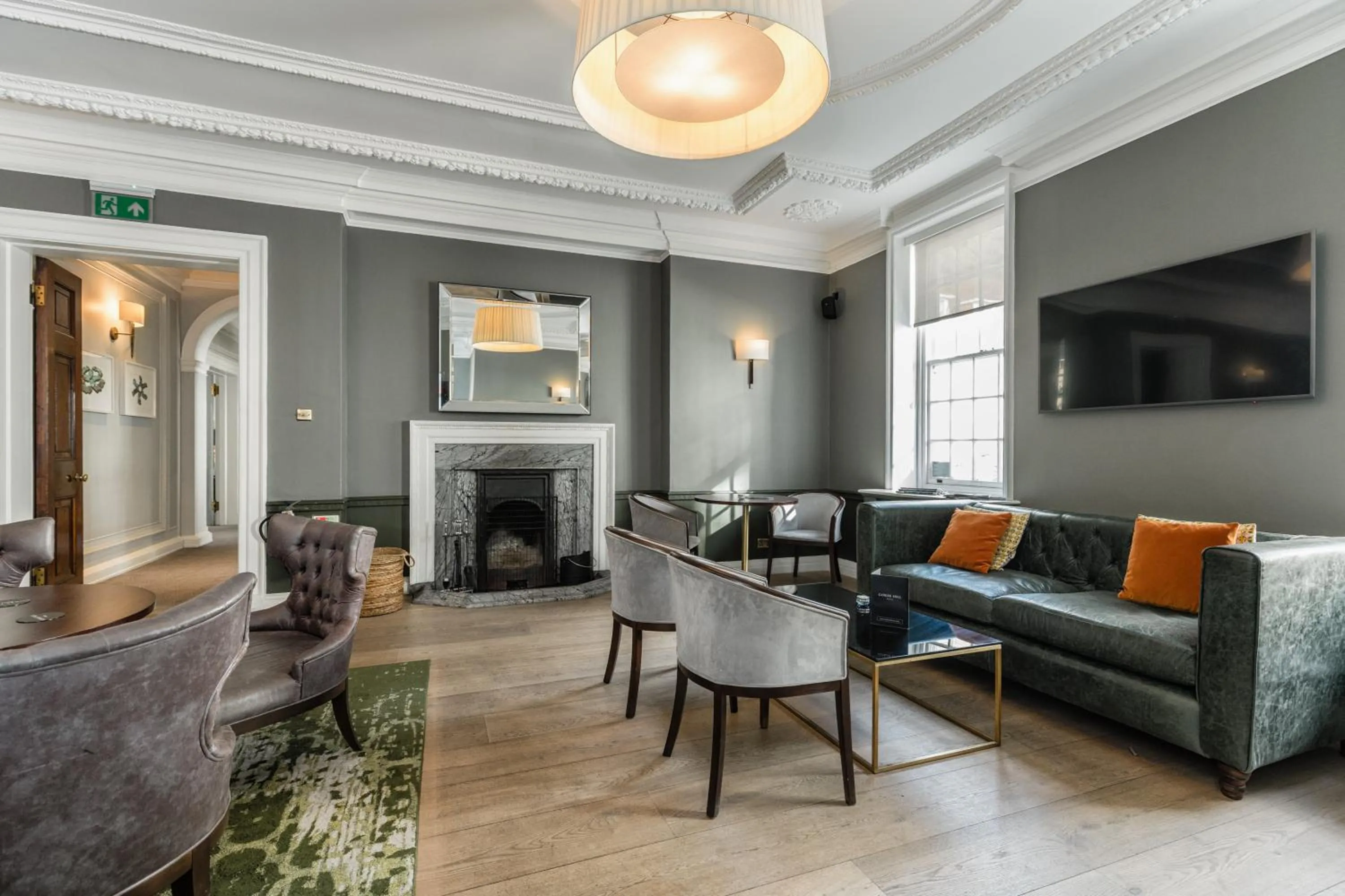 Communal lounge/ TV room in Gorse Hill Hotel