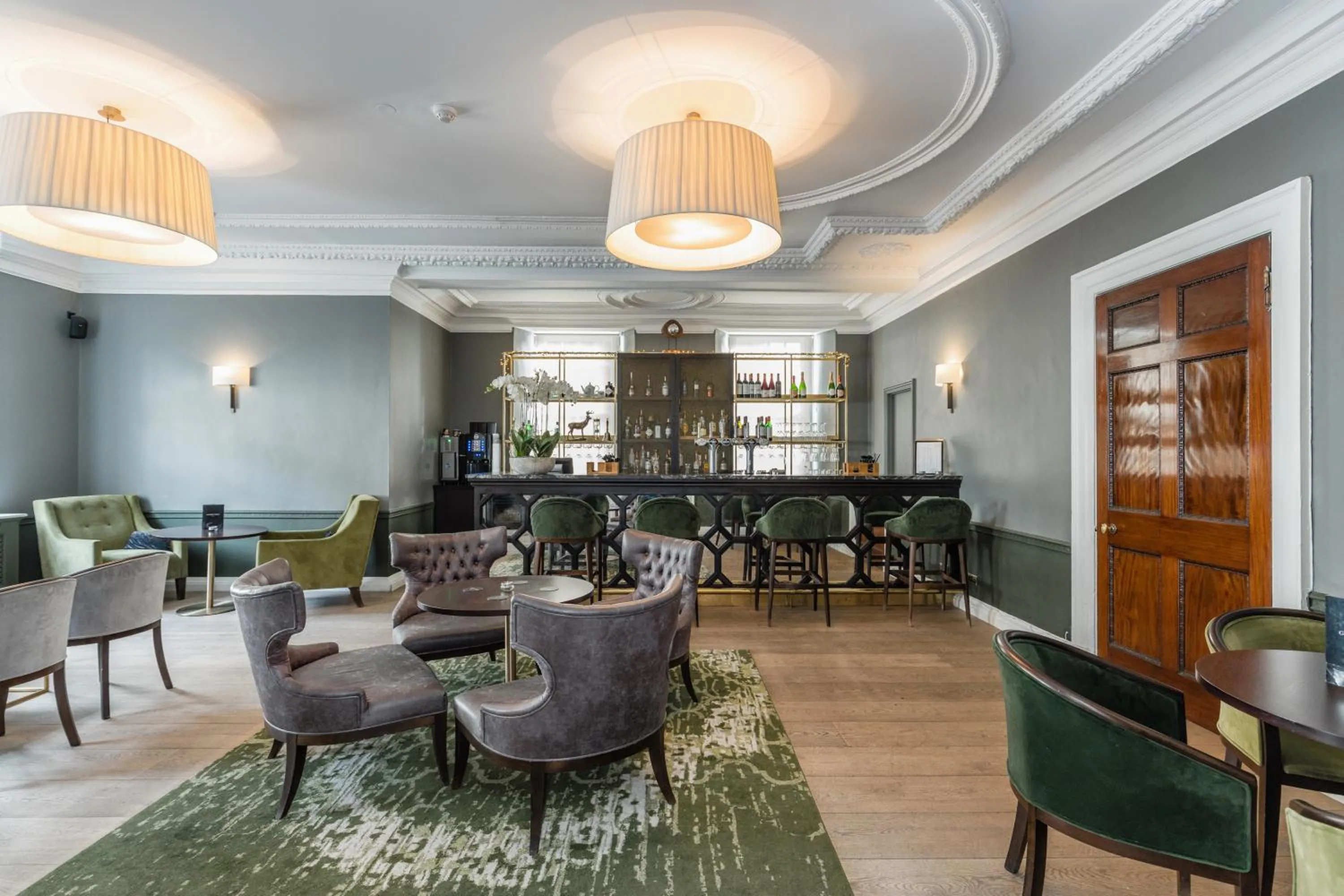 Communal lounge/ TV room in Gorse Hill Hotel