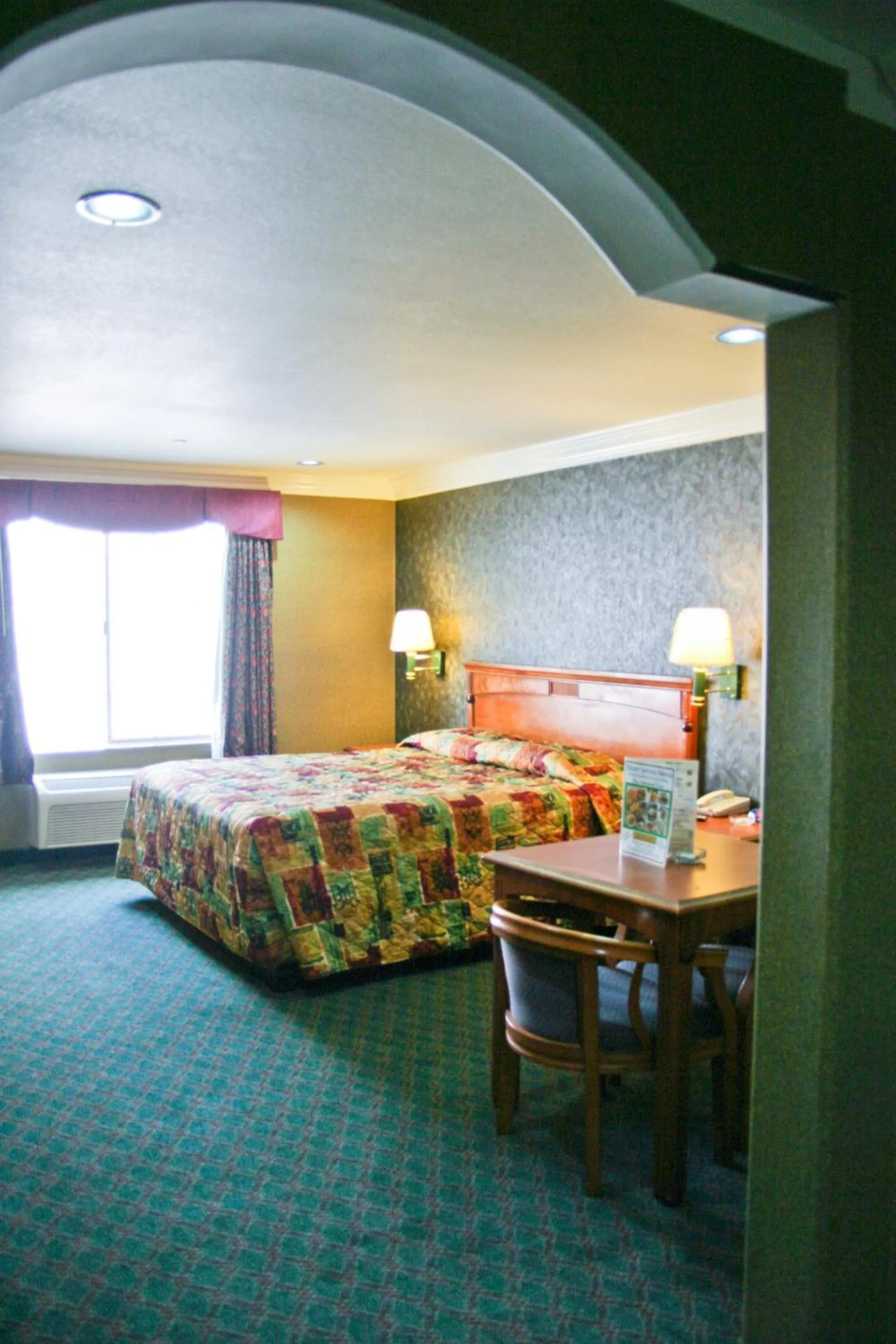 Bed in Crystal Inn Suites & Spas